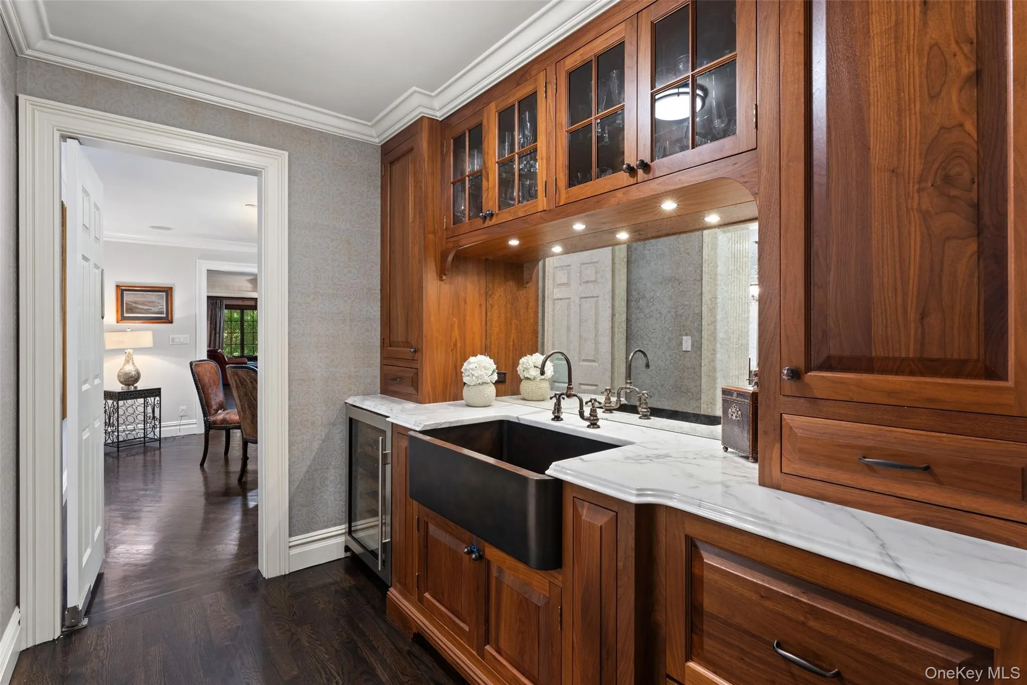Butlers pantry with custom cabinetry and carera marble countertops Butlers pantry with custom cabinetry and carera marble countertops