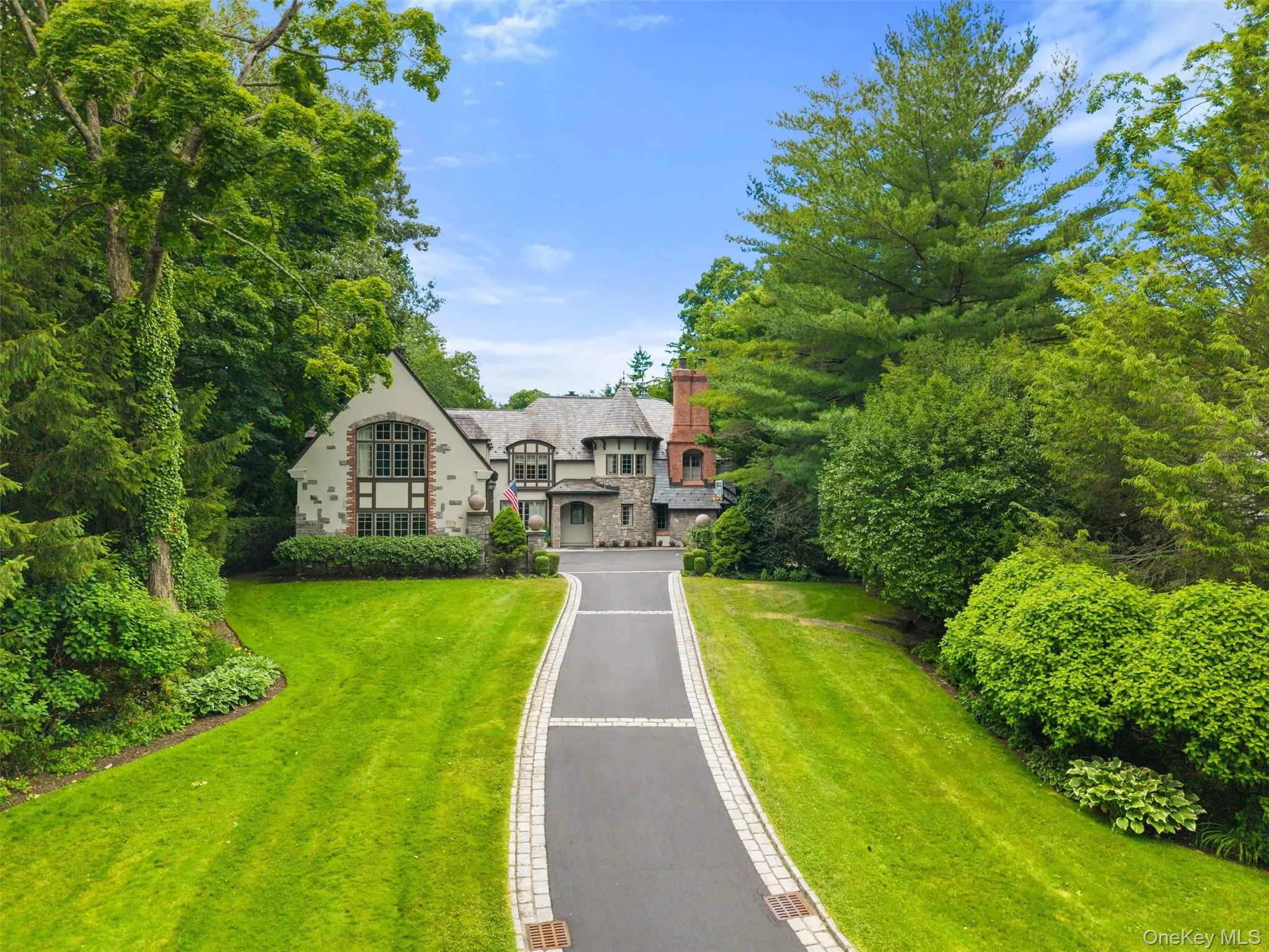 A long private driveway creates impressive approach set back from the road. A long private driveway creates impressive approach set back from the road.