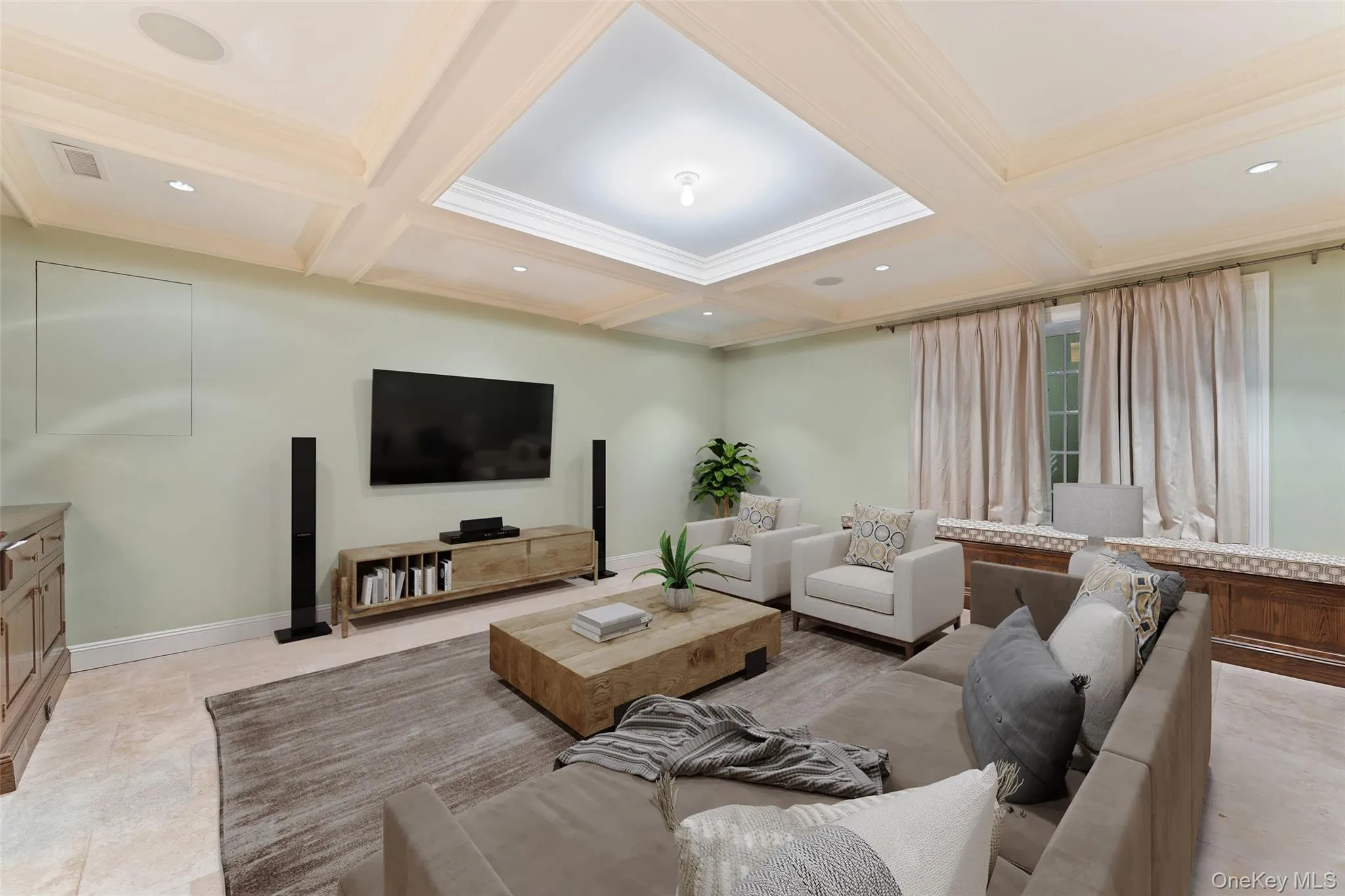 Lower level virtually staged recreation room with custom built in cabinetry Lower level virtually staged recreation room with custom built in cabinetry