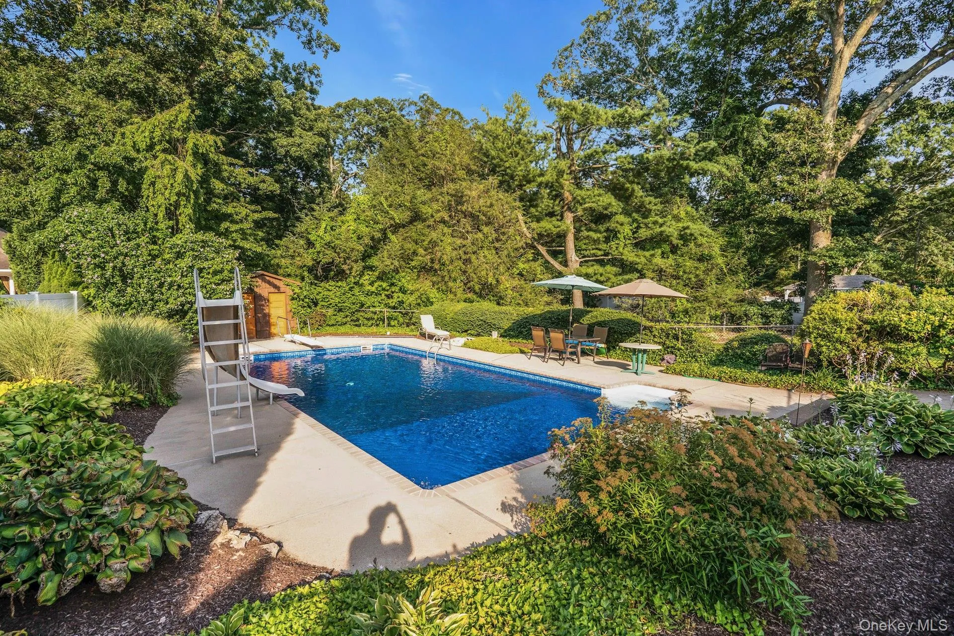 Built-in pool with diving board and slide. Built-in pool with diving board and slide.