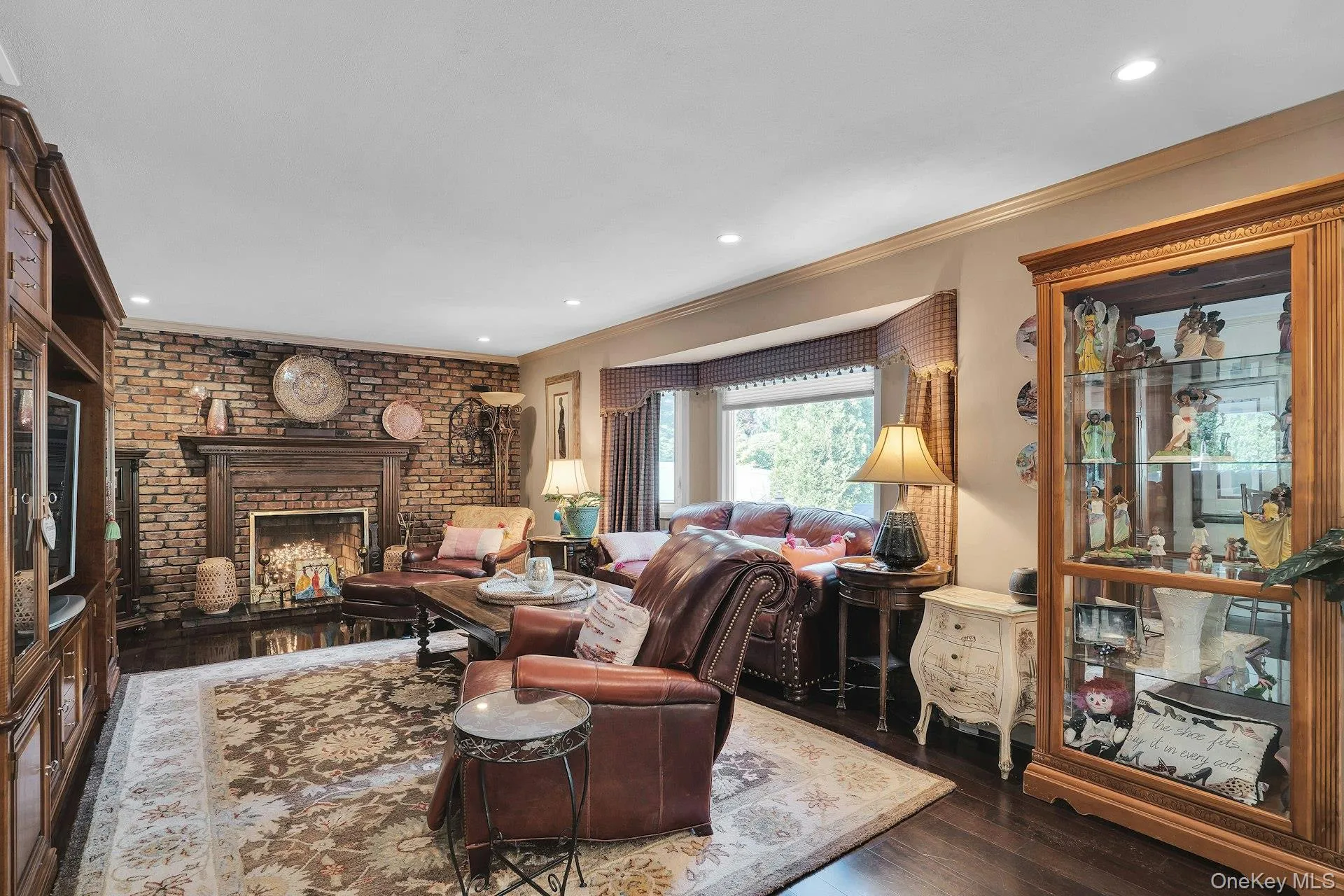 Family room with brick woodburning fireplace. Family room with brick woodburning fireplace.