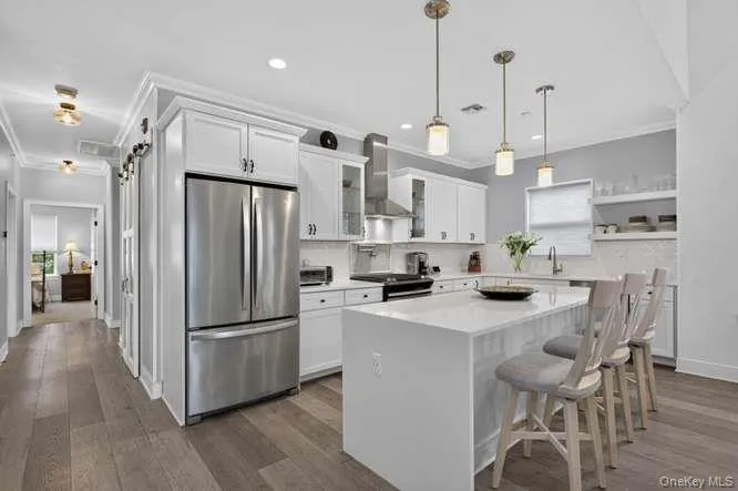 Eat in Kitchen with View of Hallway. Custom Made Pantry with Barn Doors. Eat in Kitchen with View of Hallway. Custom Made Pantry with Barn Doors.