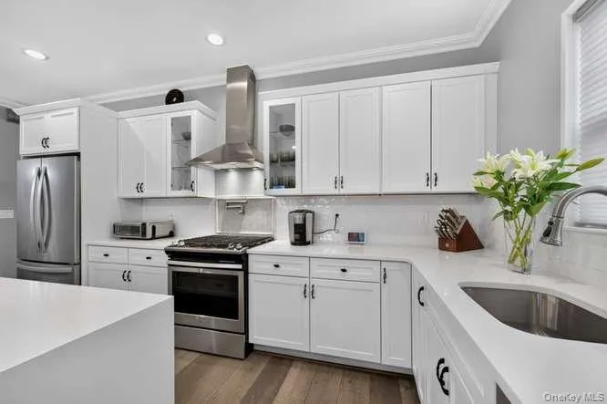 With Stainless Steel Appliances, Granite Countertops, Hi Hats, and Waterfall Island. With Stainless Steel Appliances, Granite Countertops, Hi Hats, and Waterfall Island.