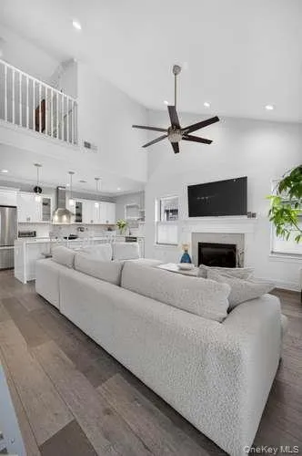 With View of Upstairs Loft. Living Room offers Open Floor Plan to Kitchen and Dining Area. With View of Upstairs Loft. Living Room offers Open Floor Plan to Kitchen and Dining Area.