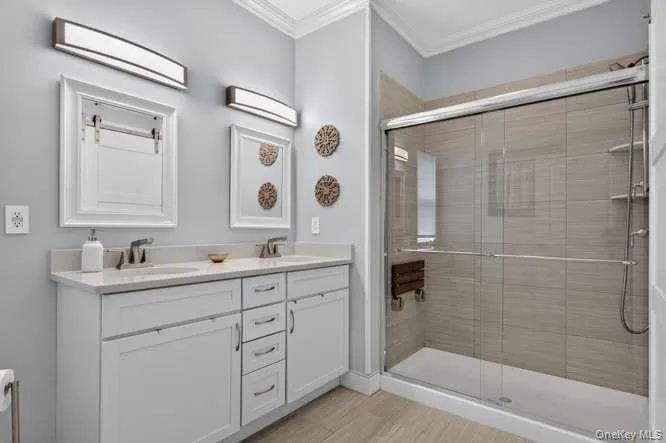 With Double Sink Vanity and Luxury Spa Seating in Shower With Double Sink Vanity and Luxury Spa Seating in Shower