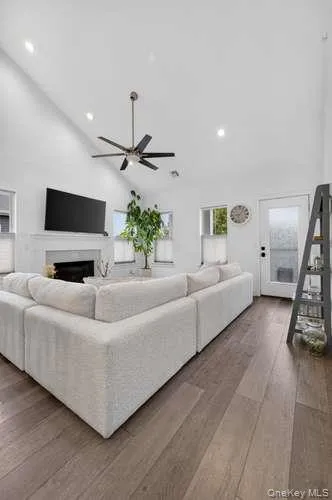 With Cathedral Ceilings, Hi Hats, Gas Fireplace and Entrance to Outdoor Seating Area. With Cathedral Ceilings, Hi Hats, Gas Fireplace and Entrance to Outdoor Seating Area.