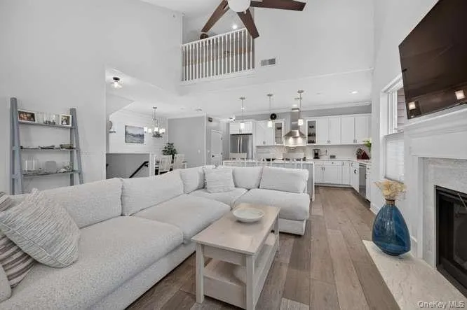 With Cathedral Ceilings, Gas Fireplace, View of Loft Area Flowing into Eat in Kitchen and Dining Area. With Cathedral Ceilings, Gas Fireplace, View of Loft Area Flowing into Eat in Kitchen and Dining Area.