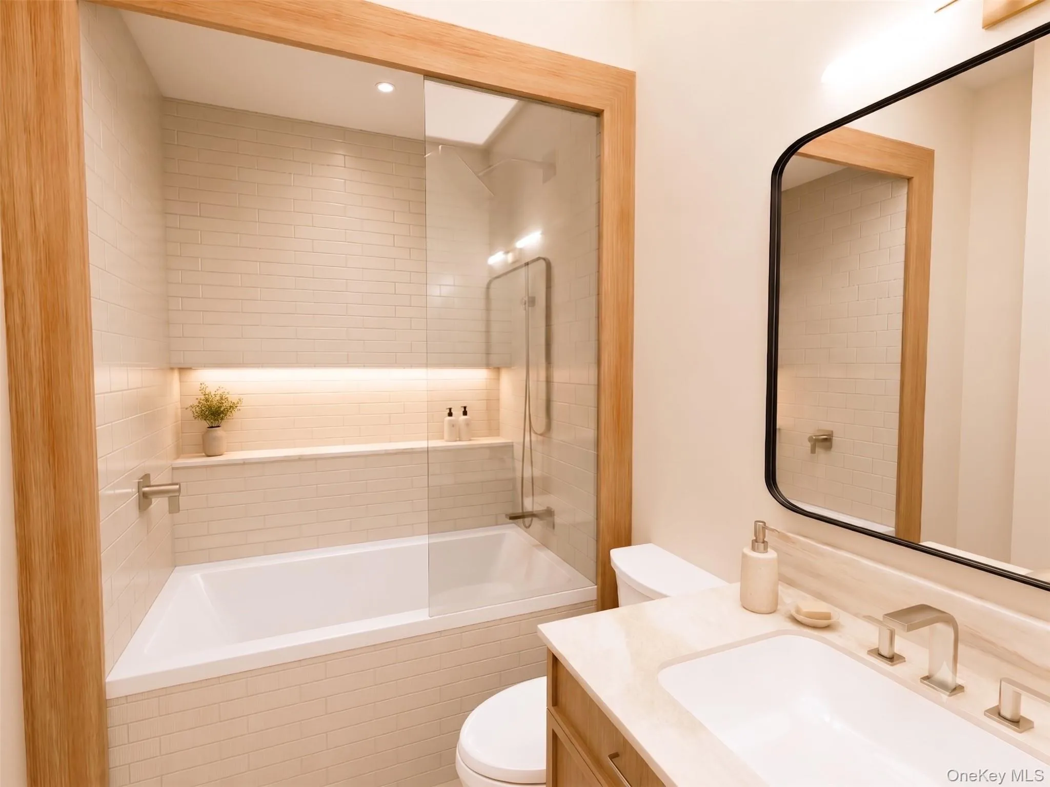 The second bathroom features marble and porcelain Ann Sacks tiles, Kohler fixtures, a single sink, and white oak custom cabinetry with Ann Sacks marble countertop. The second bathroom features marble and porcelain Ann Sacks tiles, Kohler fixtures, a single sink, and white oak custom cabinetry with Ann Sacks marble countertop.