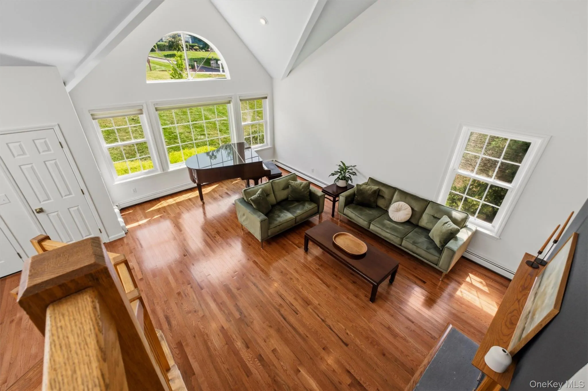 Natural light pours into the dramatic living room from multiple exposures. Natural light pours into the dramatic living room from multiple exposures.
