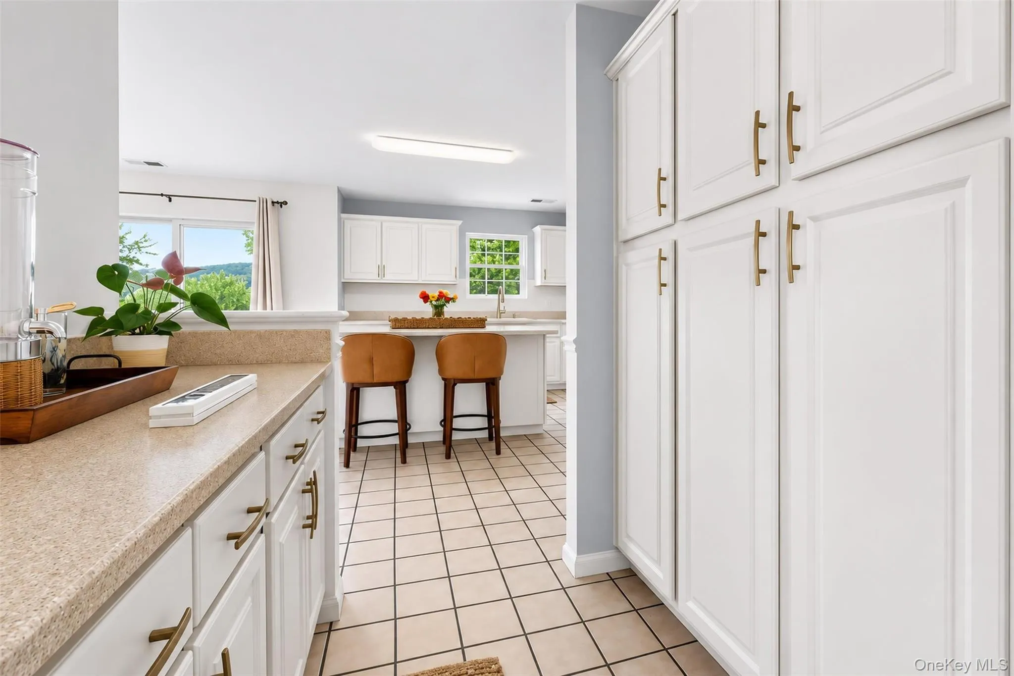 Convenient coffee bar adds extra storage and counter space just off the kitchen. Convenient coffee bar adds extra storage and counter space just off the kitchen.