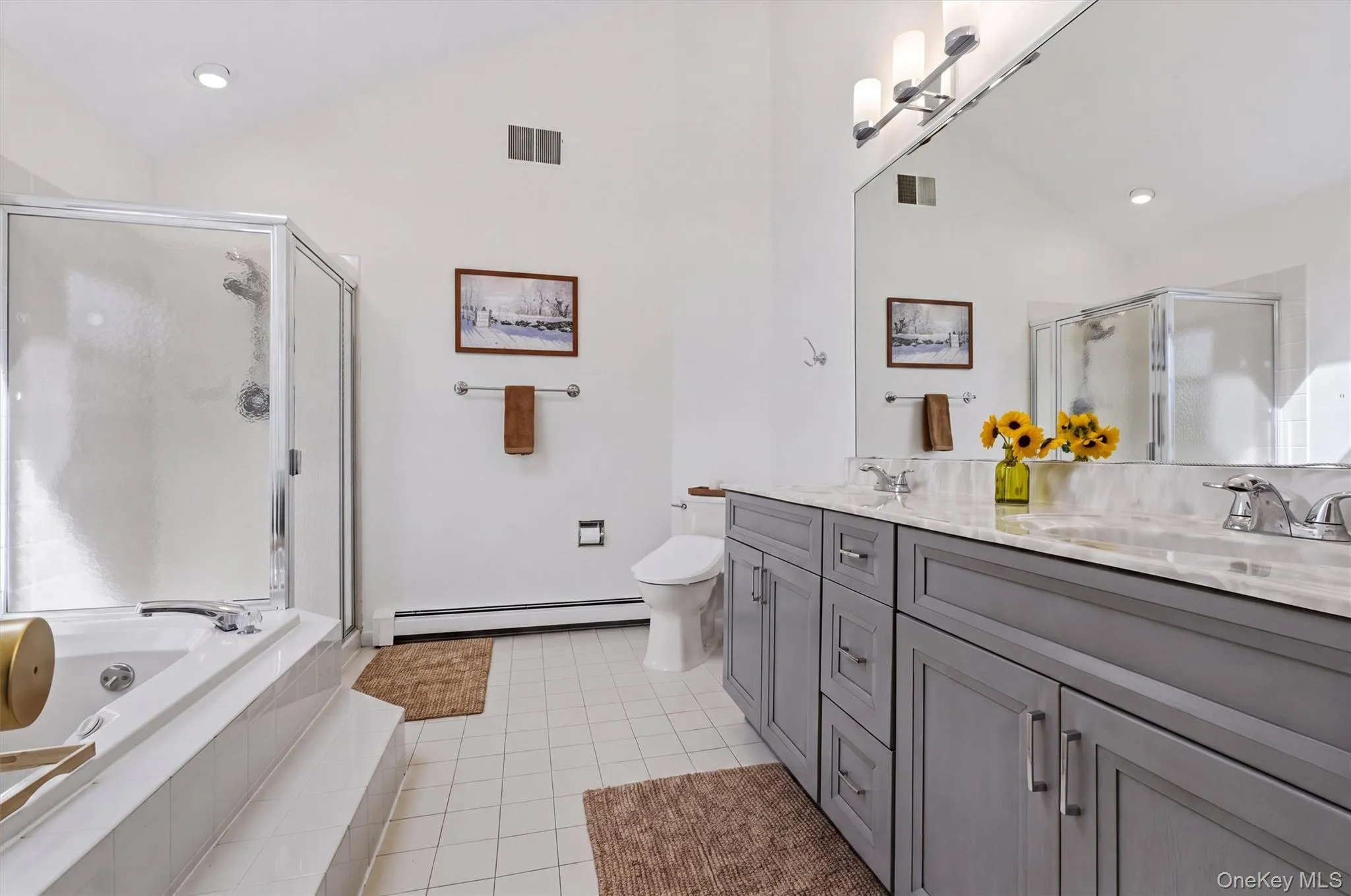Private ensuite bath with double vanity, soaking tub and separate shower. Private ensuite bath with double vanity, soaking tub and separate shower.