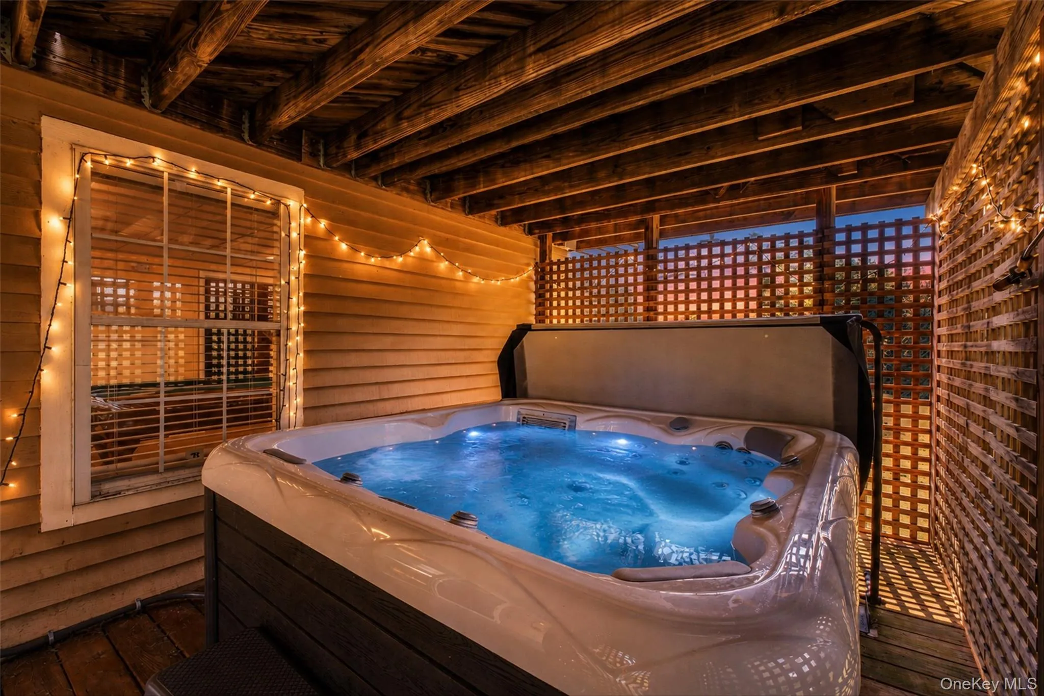 A private covered hot tub makes the outdoor space enjoyable in every season. A private covered hot tub makes the outdoor space enjoyable in every season.
