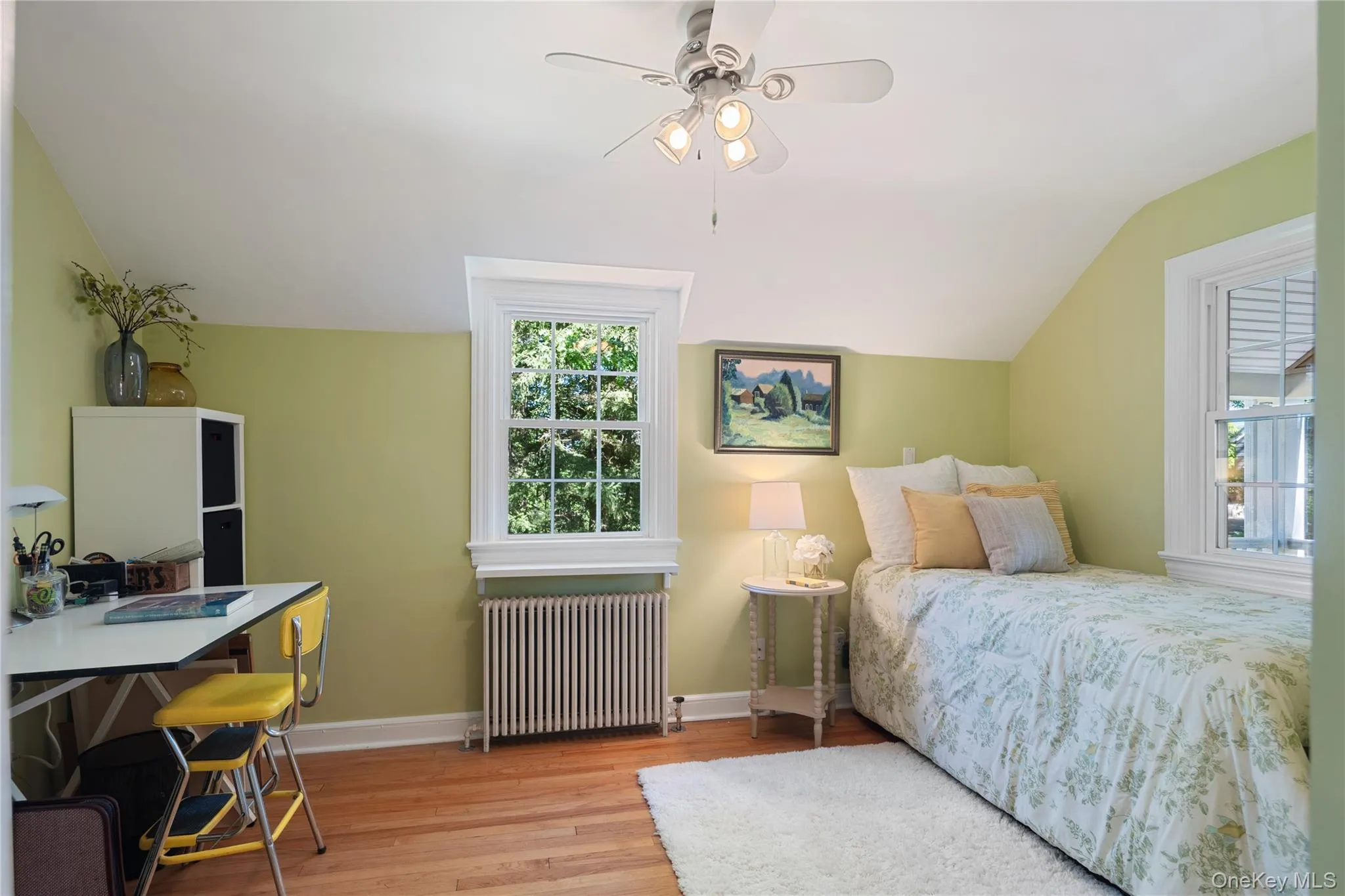 Bedroom 2 offers a deep closet, ceiling fan, and multiple windows. Bedroom 2 offers a deep closet, ceiling fan, and multiple windows.