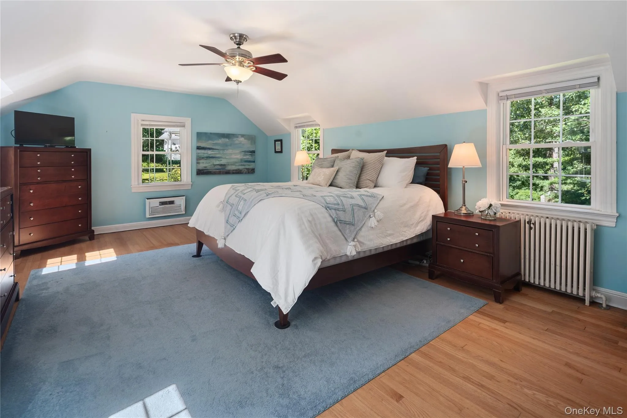 The generously sized primary bedroom easily fits a king-sized bed. The generously sized primary bedroom easily fits a king-sized bed.