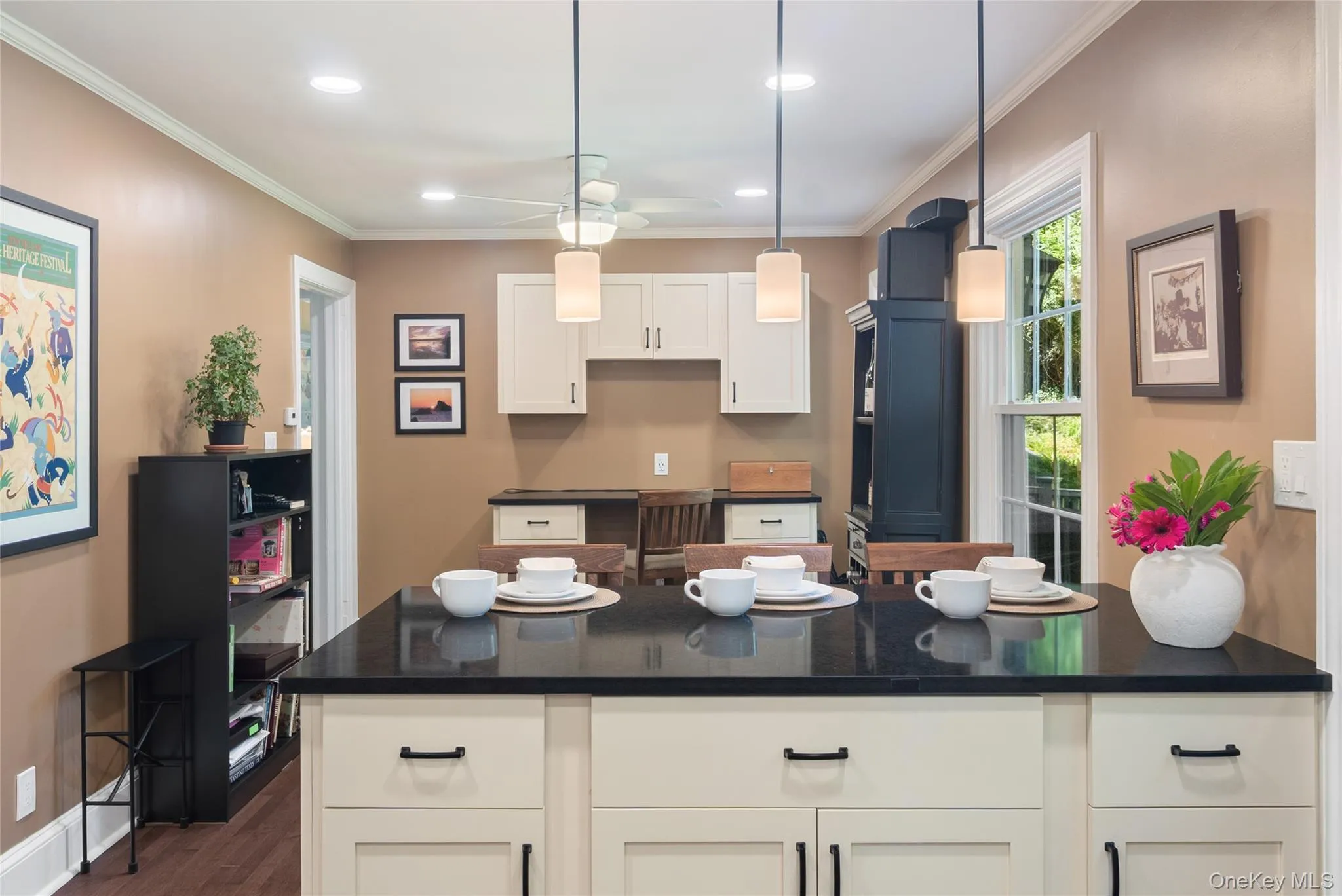 From the kitchen, you can see into the workstation with its desk, and just beyond the doorway lies the living room. From the kitchen, you can see into the workstation with its desk, and just beyond the doorway lies the living room.