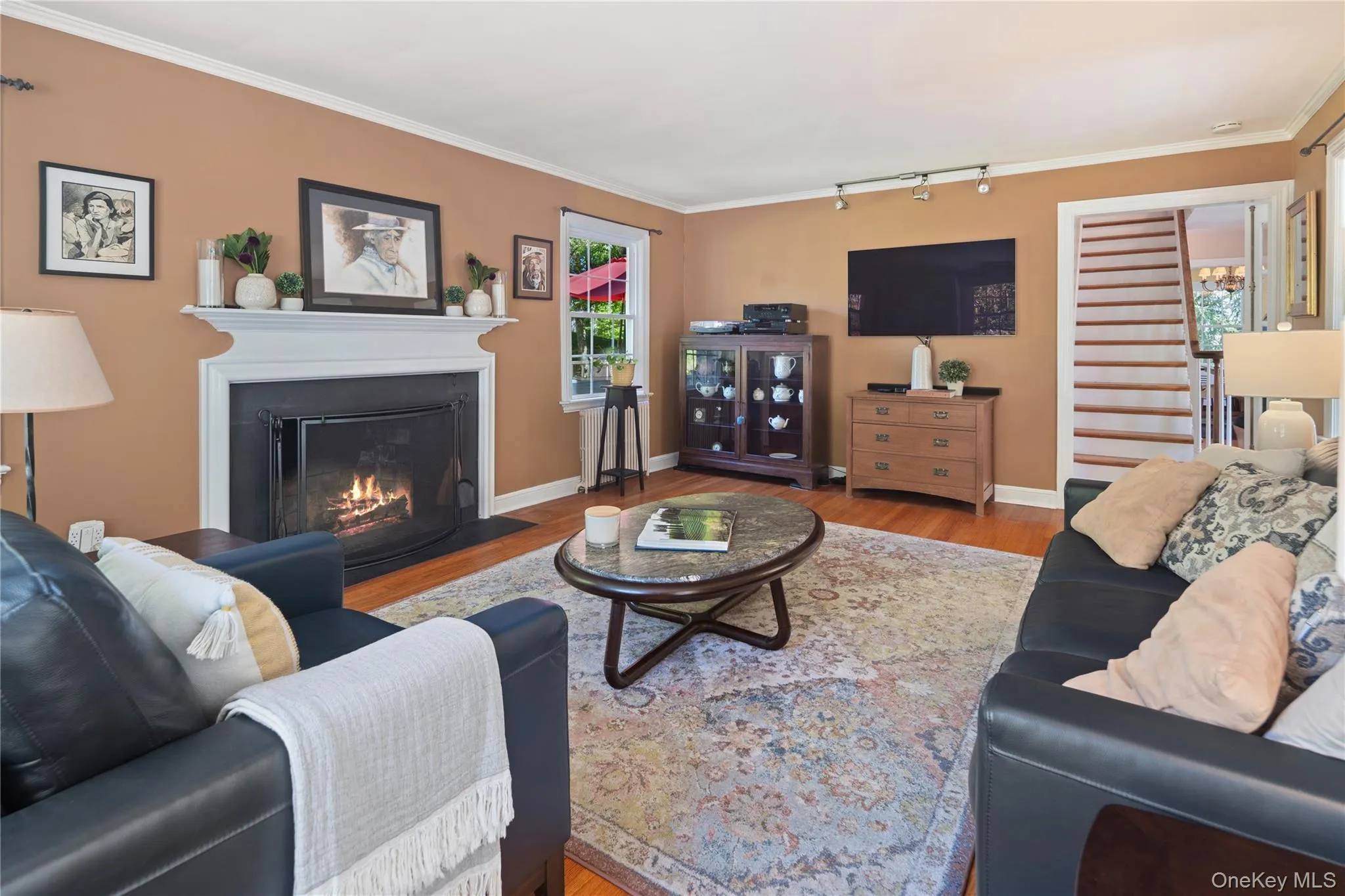 The wood-burning fireplace provides a cozy backdrop for conversations on a winter night. The wood-burning fireplace provides a cozy backdrop for conversations on a winter night.
