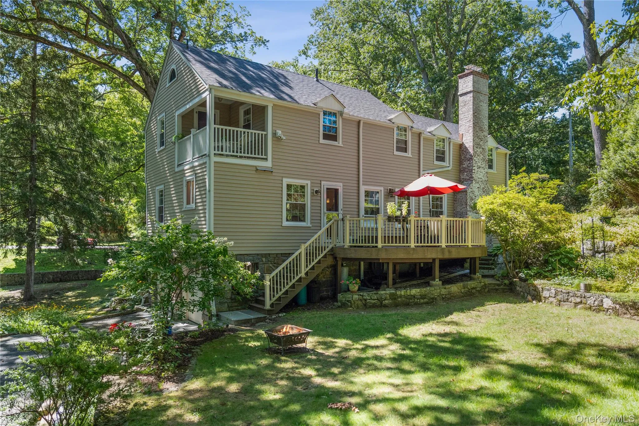 View from behind—Trex deck, mature trees, and specimen gardens. View from behind—Trex deck, mature trees, and specimen gardens.