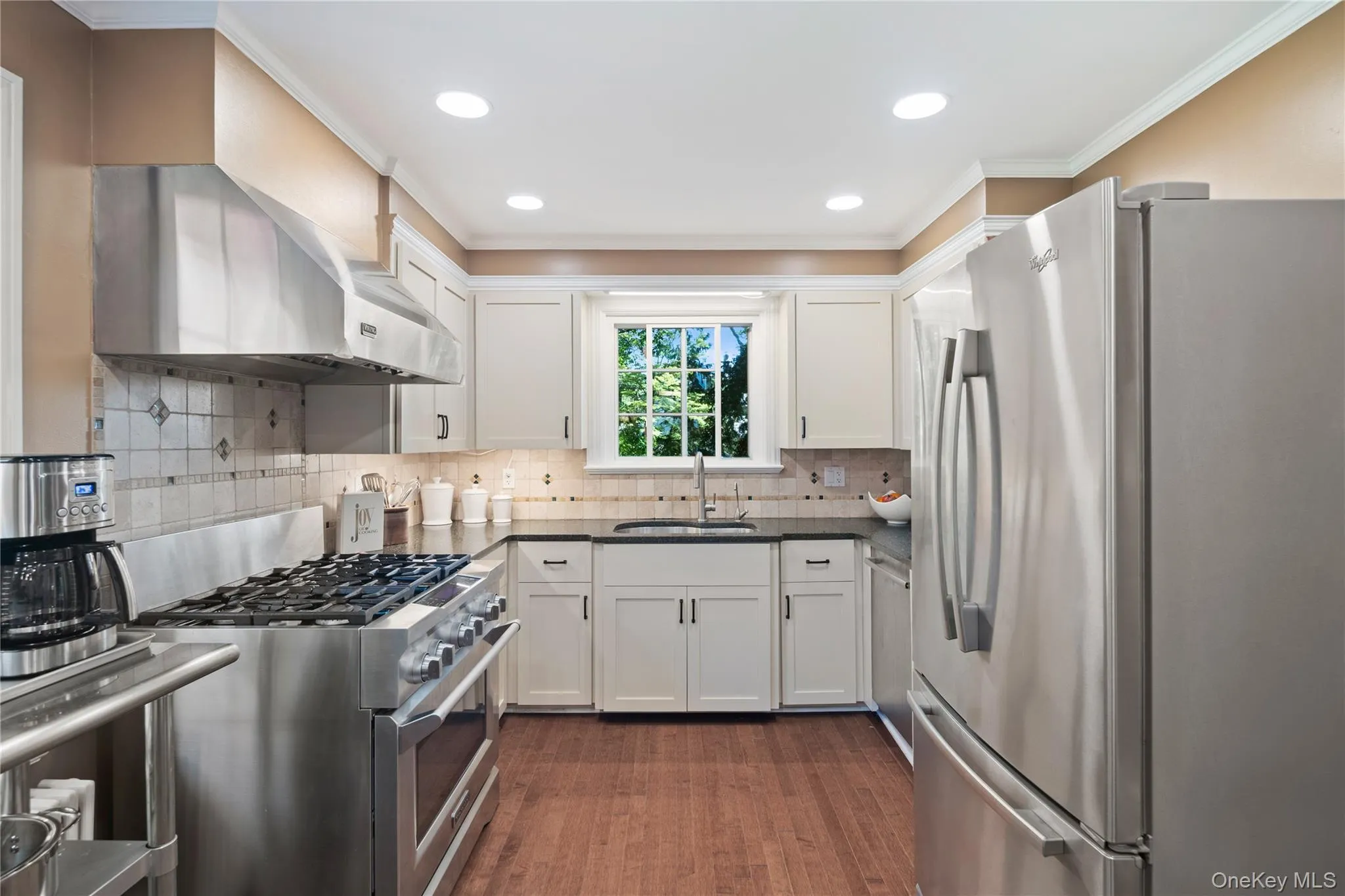 Custom cabinets, quartz countertops, and stainless steel appliances are highlights of the kitchen. Custom cabinets, quartz countertops, and stainless steel appliances are highlights of the kitchen.