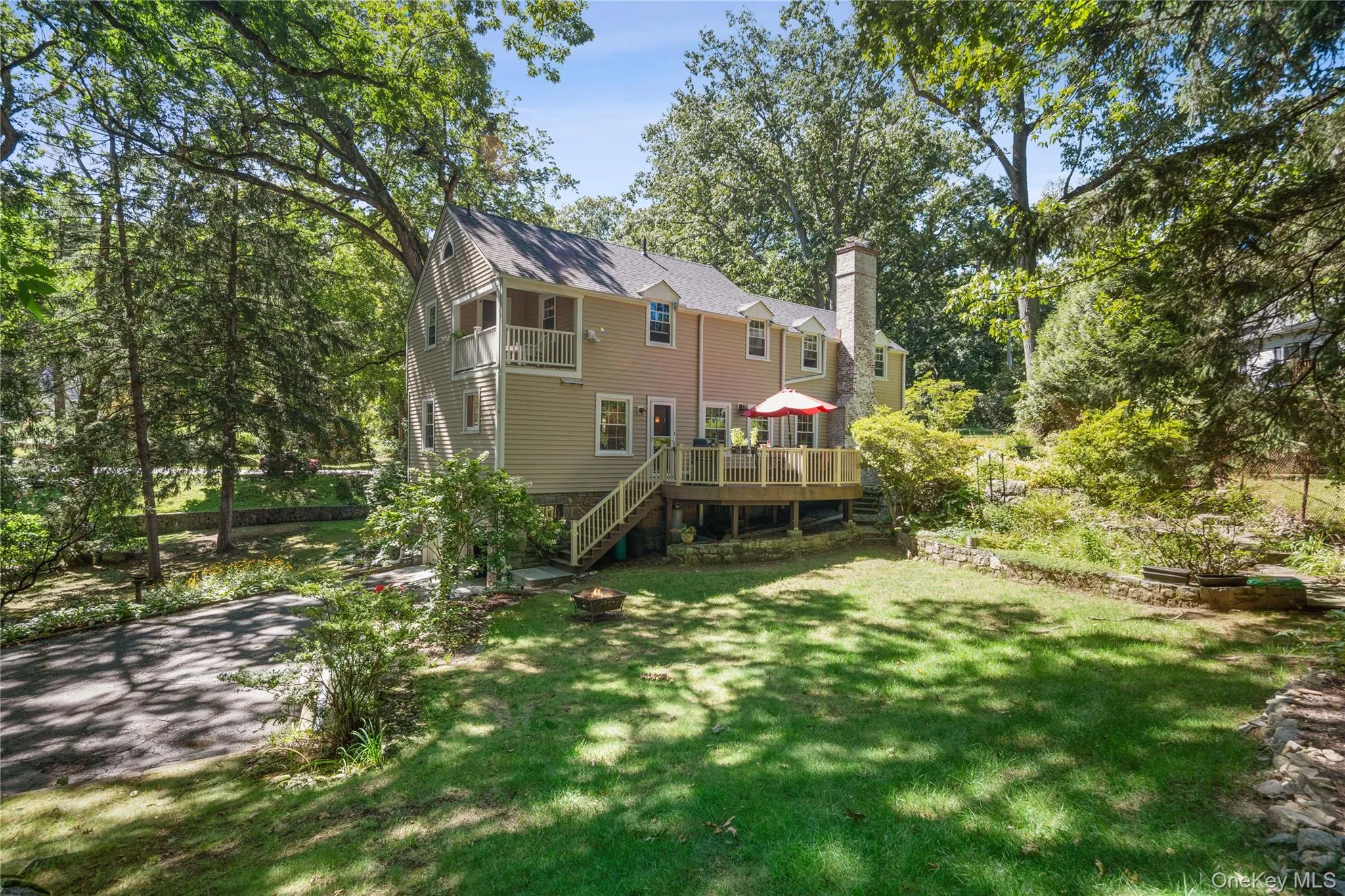 The driveway is accessed from the back of the house and leads to an attached two-car garage. The driveway is accessed from the back of the house and leads to an attached two-car garage.