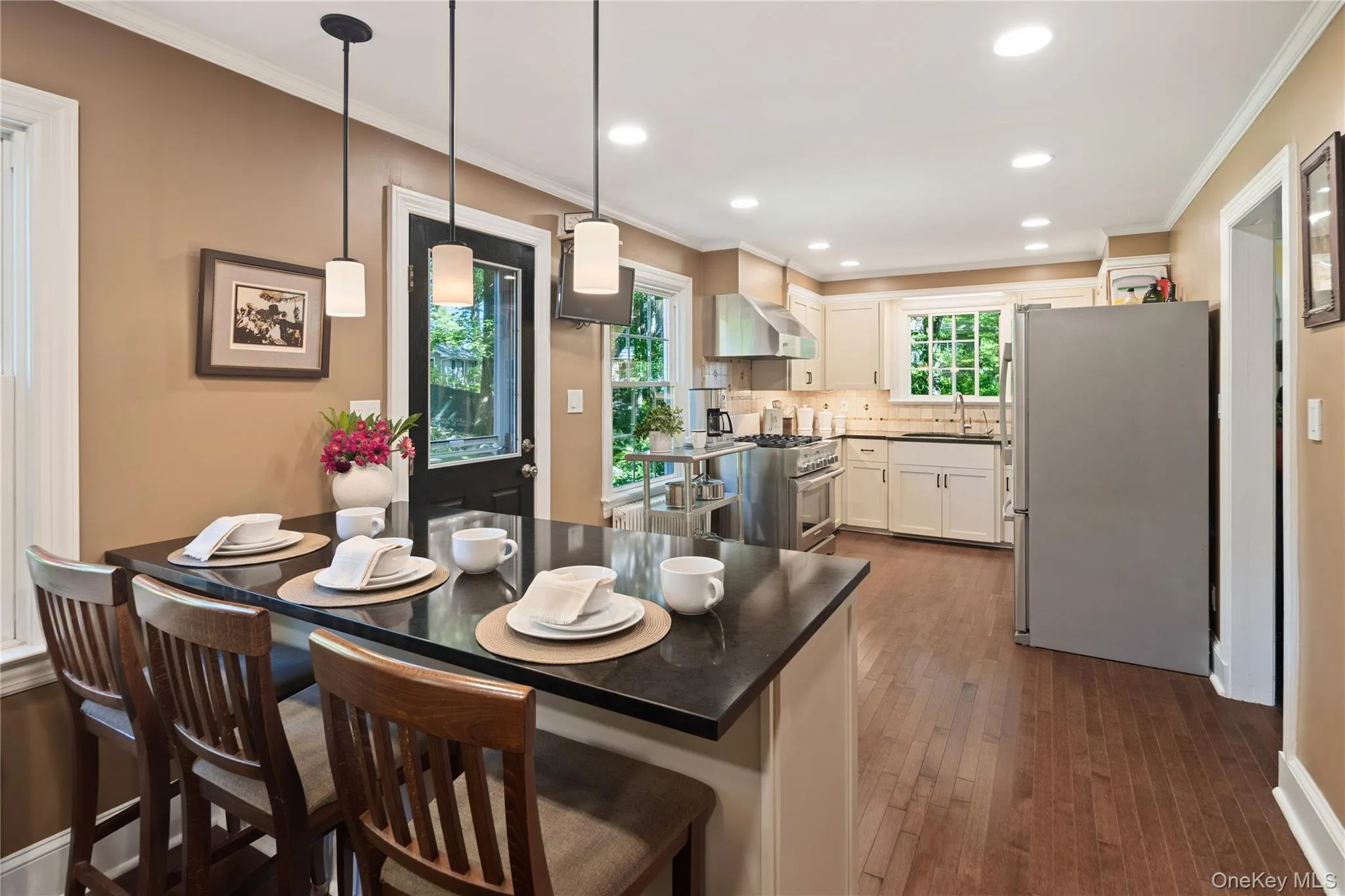 Spacious and bright with plenty of natural light and recessed lighting, featuring a breakfast bar perfect for casual meals. Spacious and bright with plenty of natural light and recessed lighting, featuring a breakfast bar perfect for casual meals.