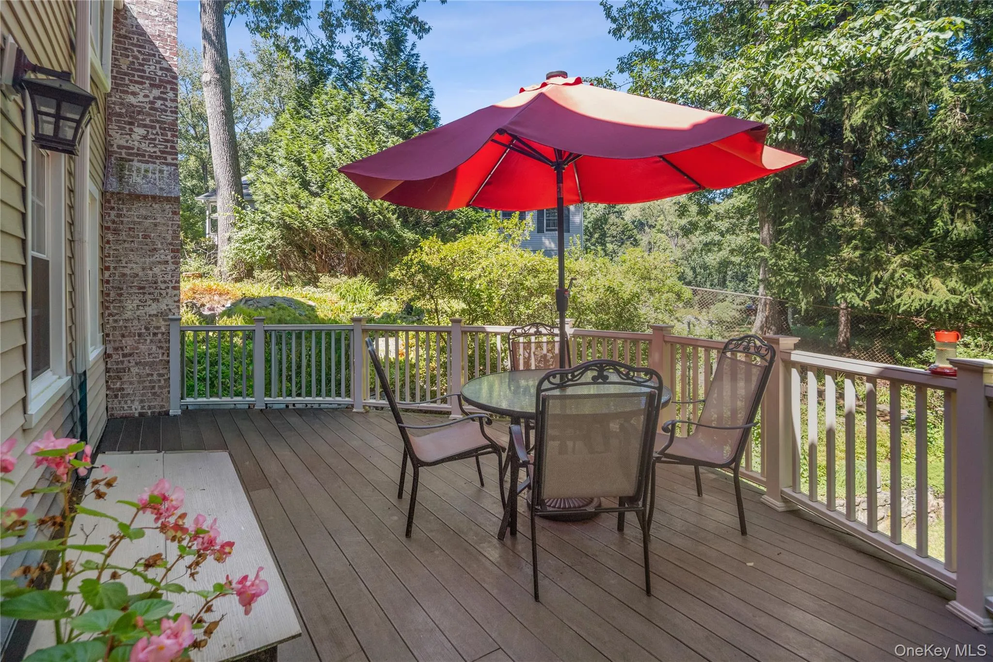 The deck is accessed from the kitchen, making indoor-outdoor dining easy.. The deck is accessed from the kitchen, making indoor-outdoor dining easy..