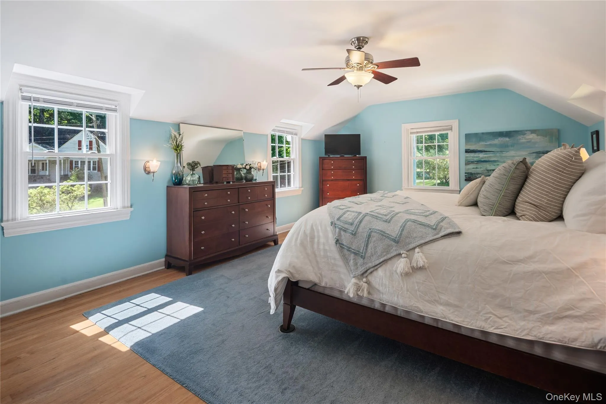 Multiple windows and a ceiling fan are additional highlights. Multiple windows and a ceiling fan are additional highlights.