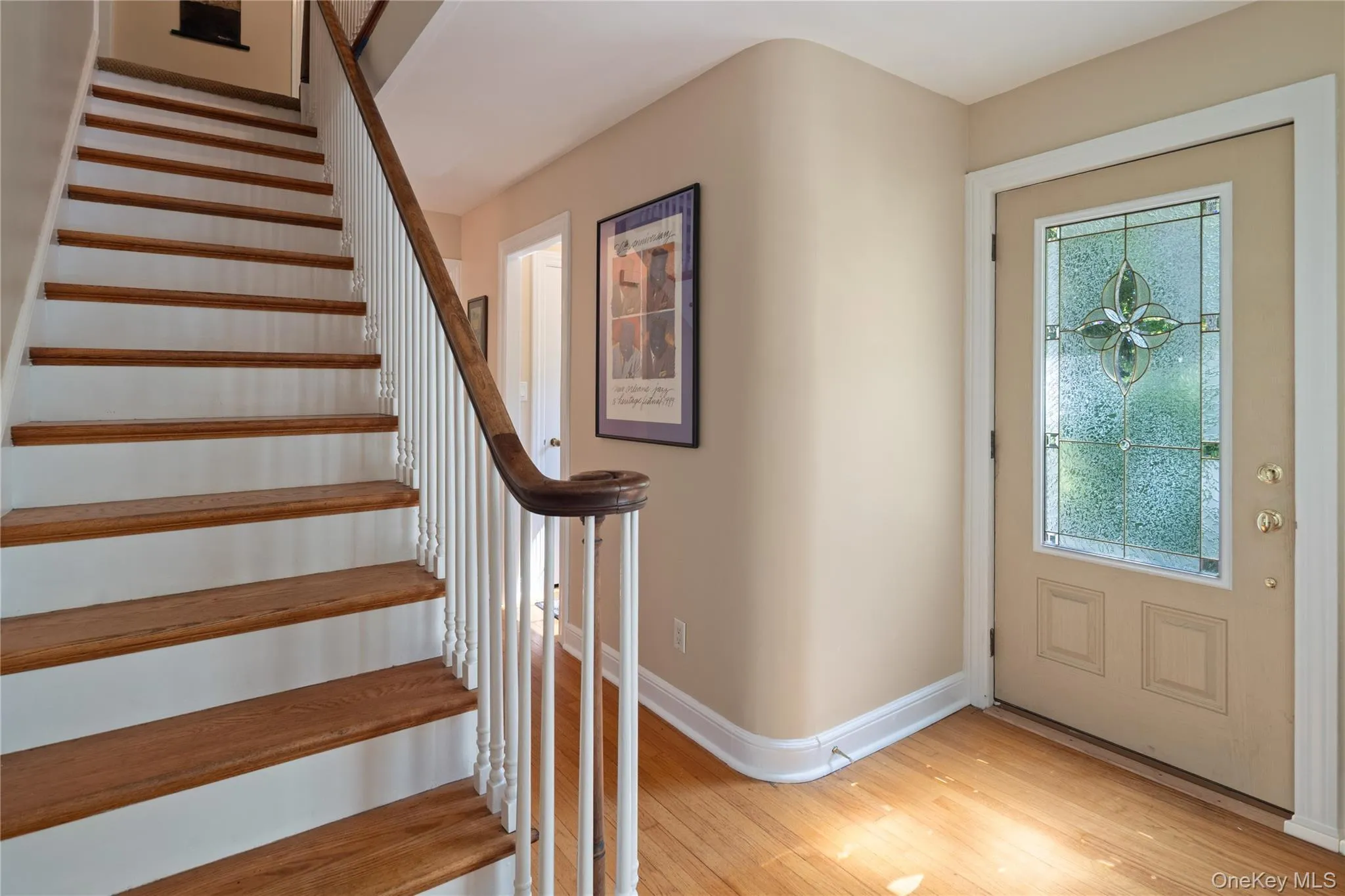 The original staircase, with its curved wooden handrail, leads you to the second floor. The original staircase, with its curved wooden handrail, leads you to the second floor.