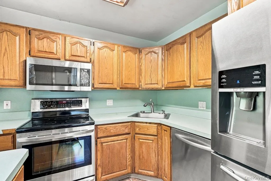 Kitchen has wood cabinets and s/s appliances First Floor Kitchen has wood cabinets and s/s appliances First Floor