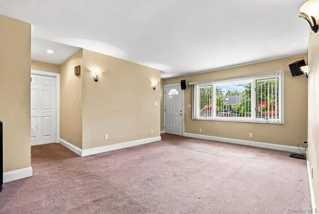 Living Room with Large window & coat closet at entrance First Floor Living Room with Large window & coat closet at entrance First Floor