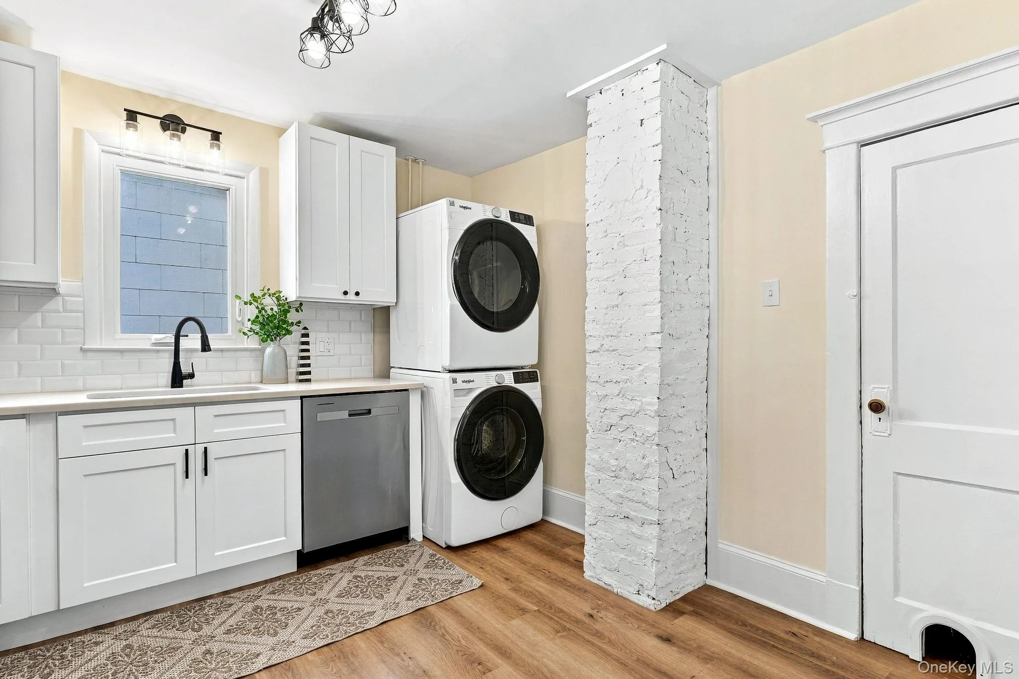 The kitchen features brand-new stainless-steel appliances, along with a washer and dryer The kitchen features brand-new stainless-steel appliances, along with a washer and dryer