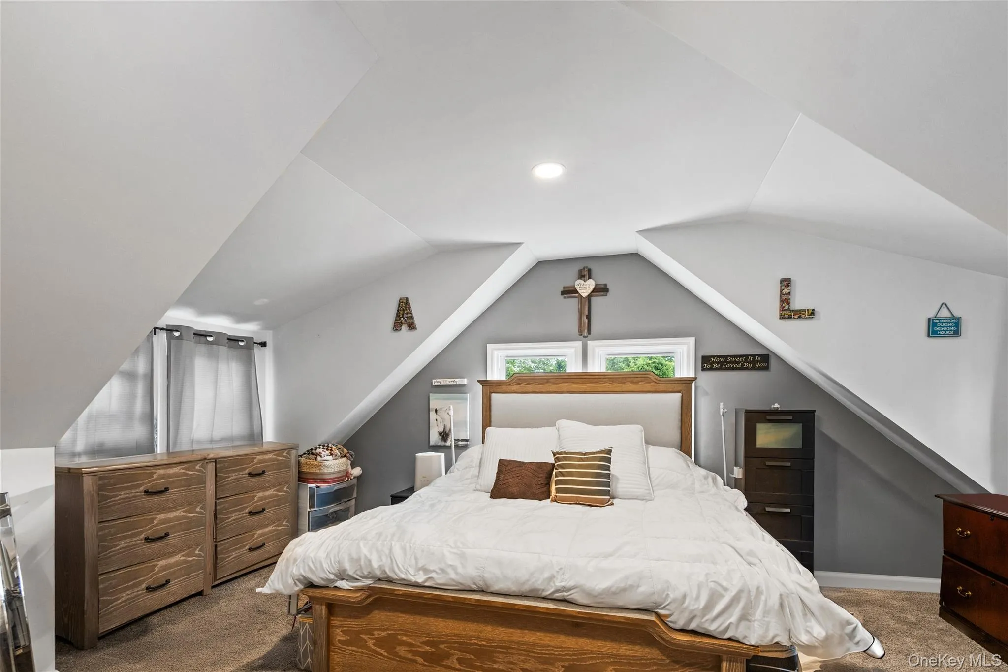 Carpeted bedroom featuring lofted ceiling Carpeted bedroom featuring lofted ceiling