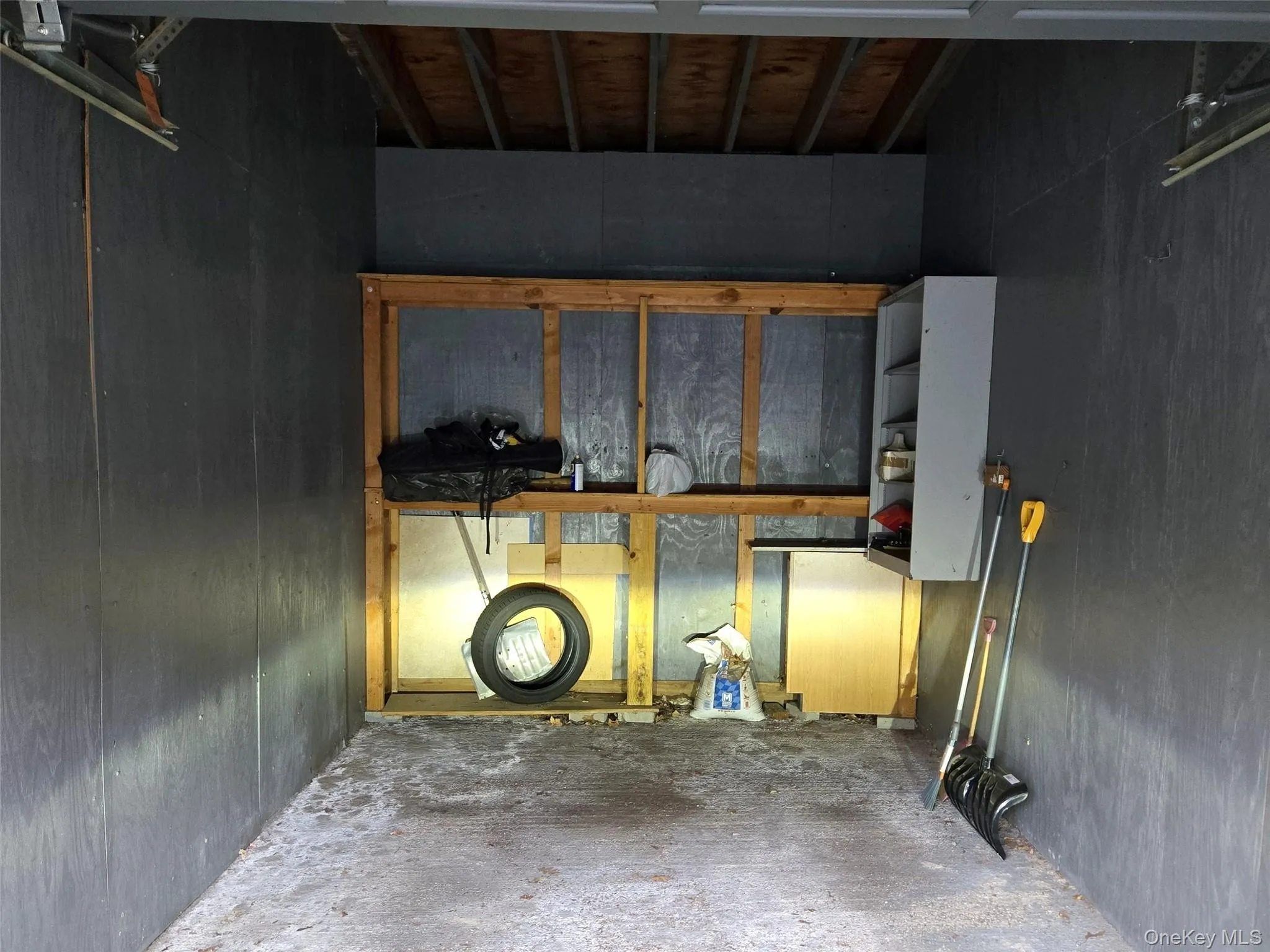Private garage interior with built-in storage shelving. Private garage interior with built-in storage shelving.