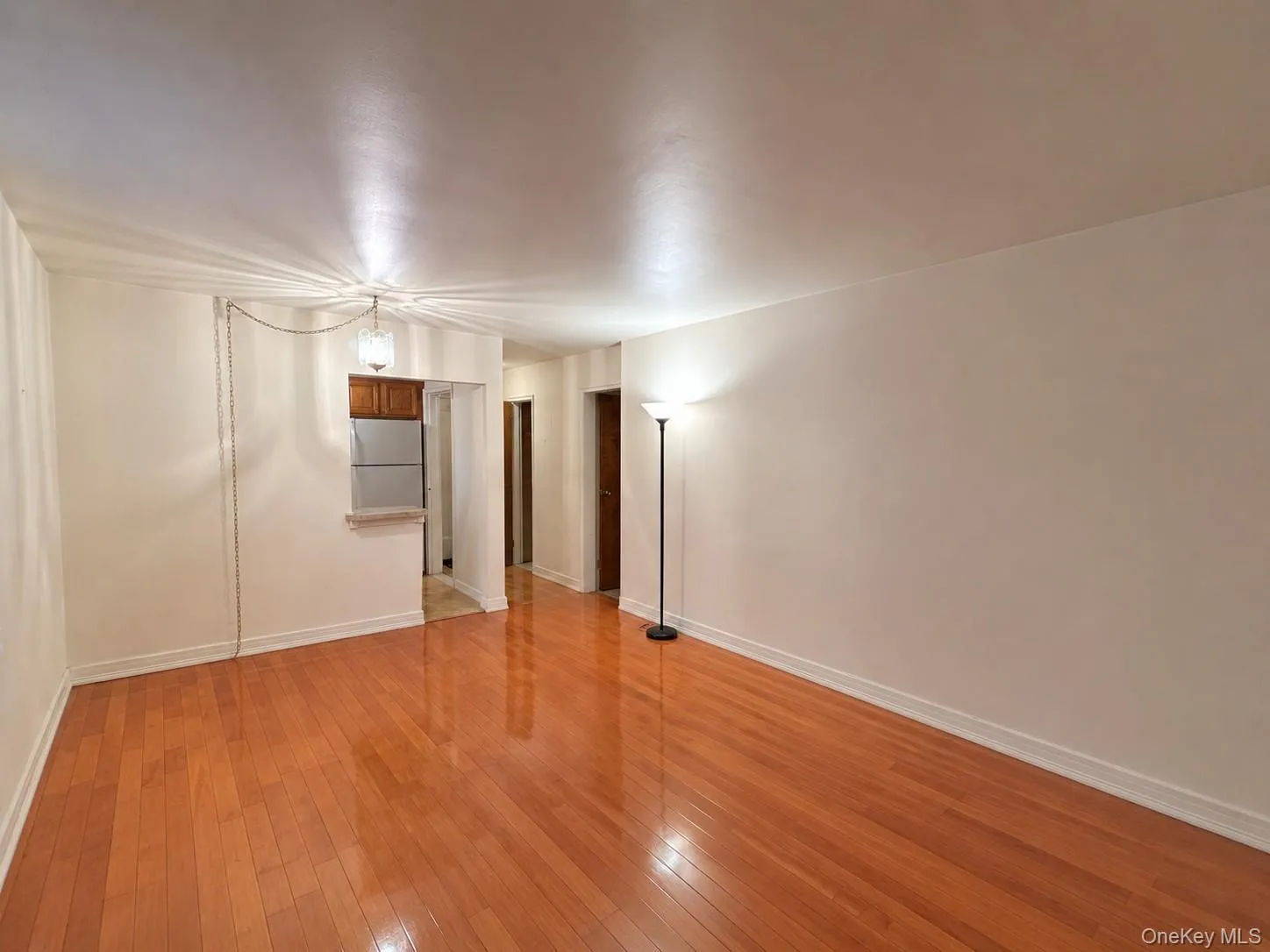 Living and dining area with wood floors, open to the kitchen. Living and dining area with wood floors, open to the kitchen.