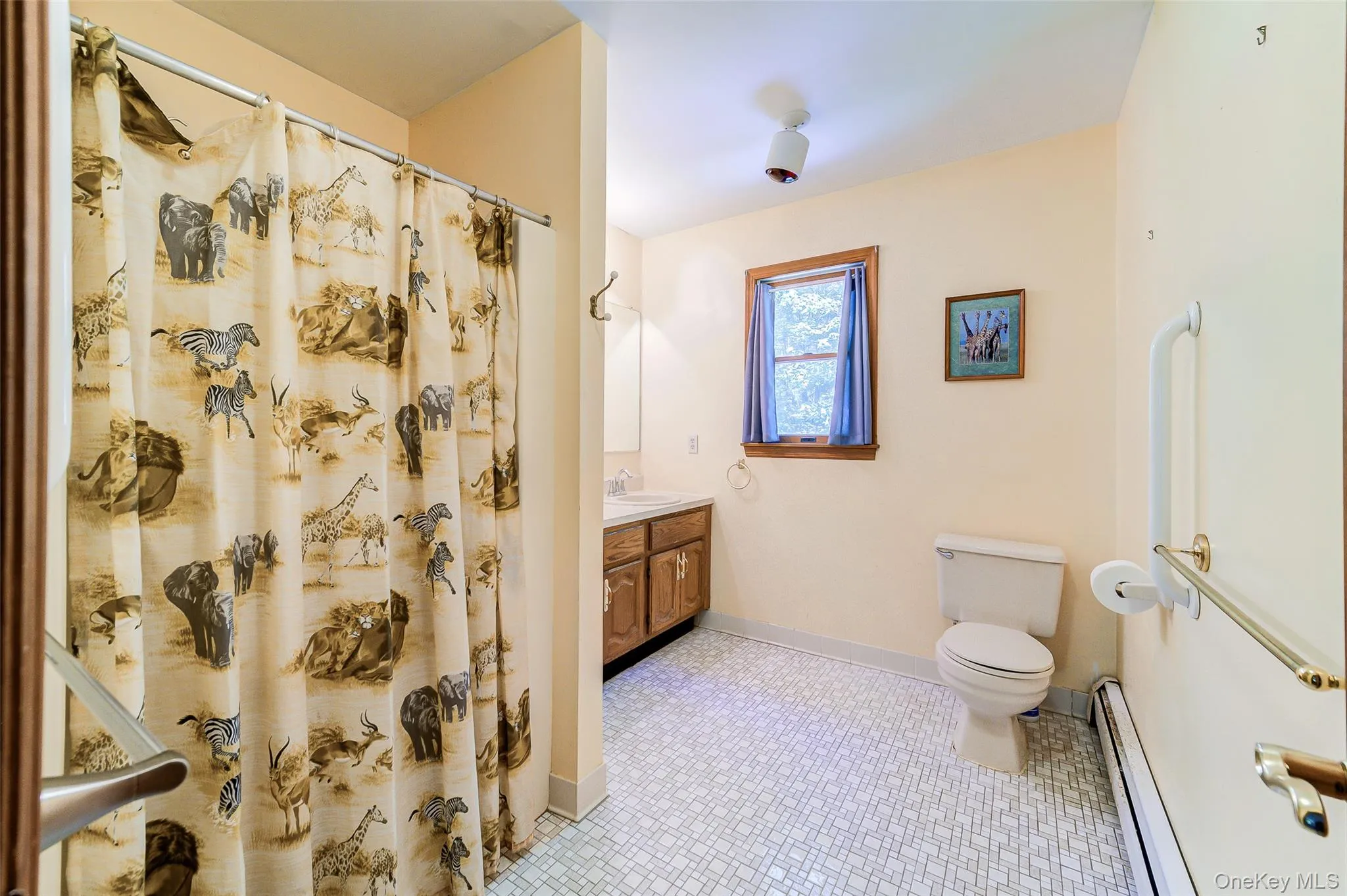 Shower/tub combination with double vanity and tile flooring Shower/tub combination with double vanity and tile flooring