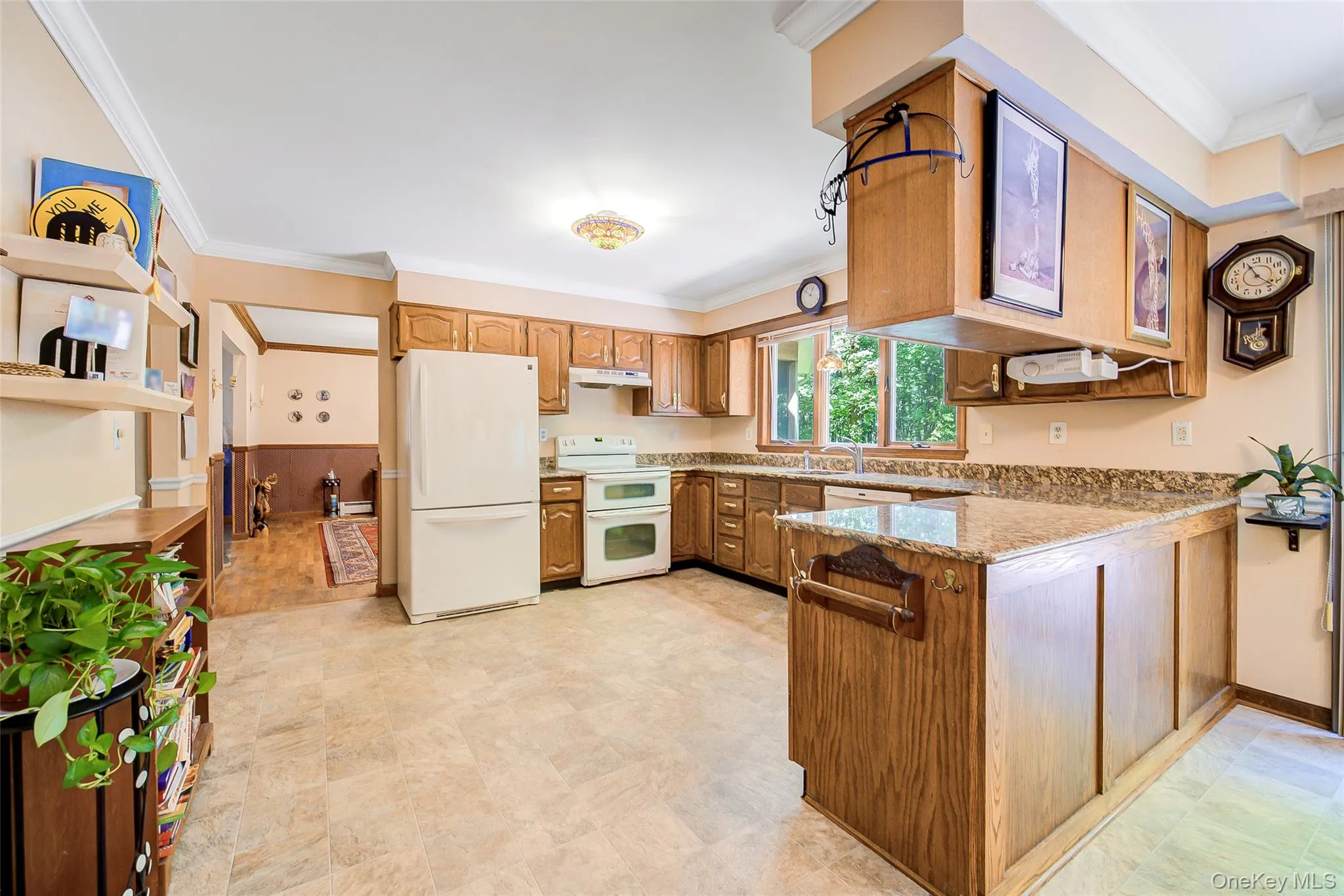 Expansive kitchen has many cabinets and counter top space for easy meal preparation. Expansive kitchen has many cabinets and counter top space for easy meal preparation.