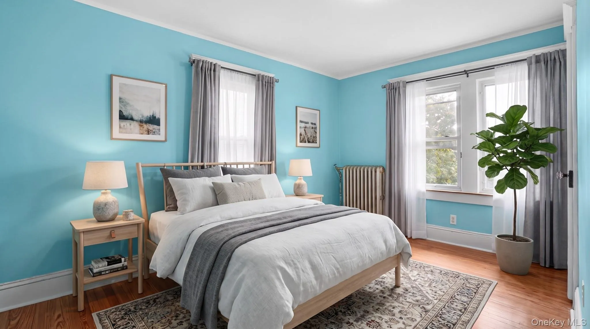 Hardwood-style flooring with white baseboards Hardwood-style flooring with white baseboards