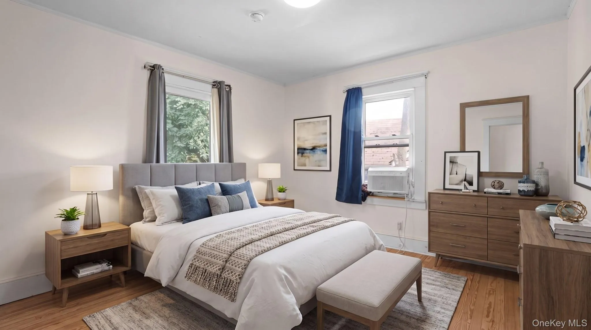Hardwood flooring, light-toned walls, and multiple windows with natural light Hardwood flooring, light-toned walls, and multiple windows with natural light