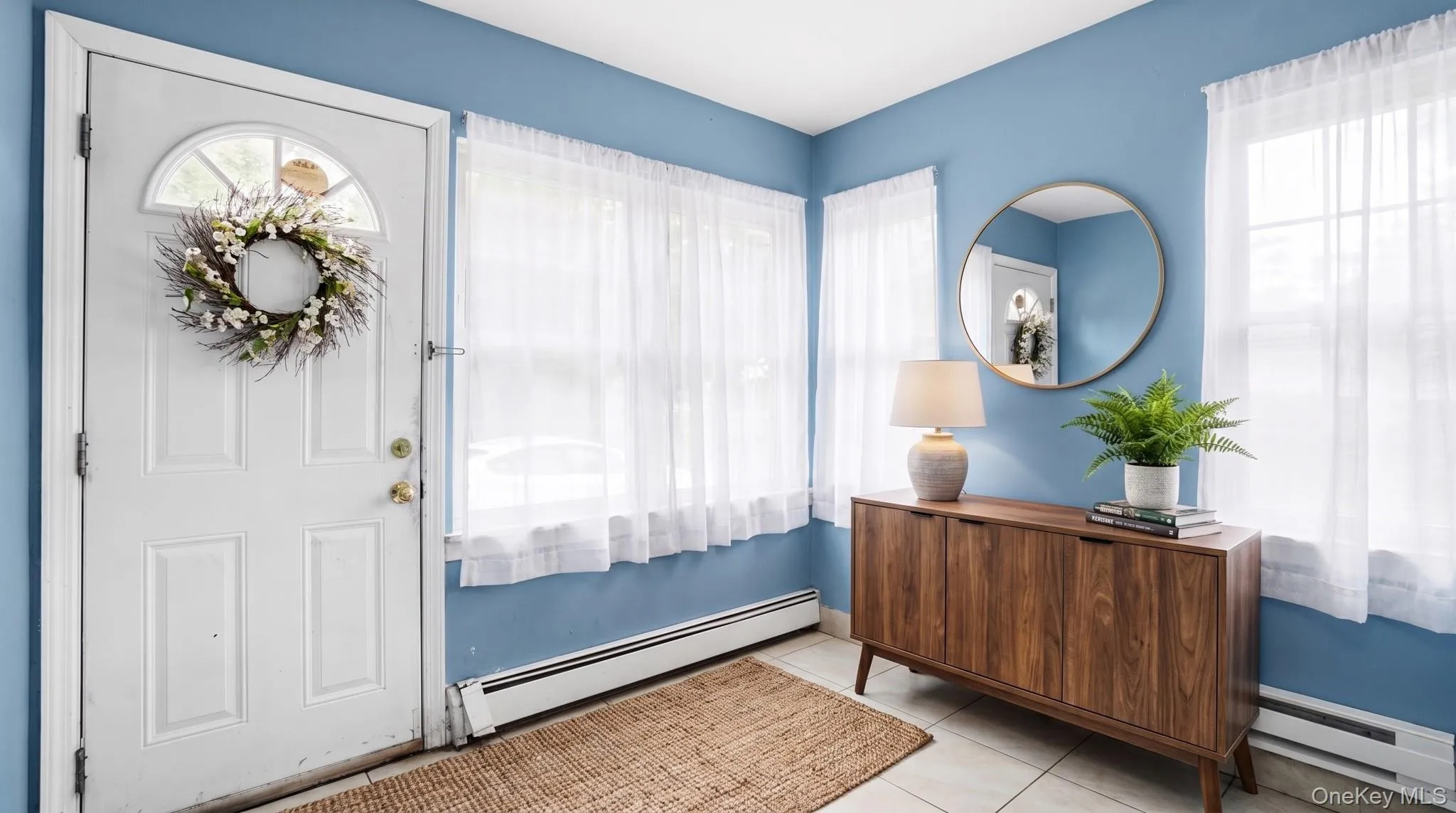 White paneled entry door with an arched transom White paneled entry door with an arched transom