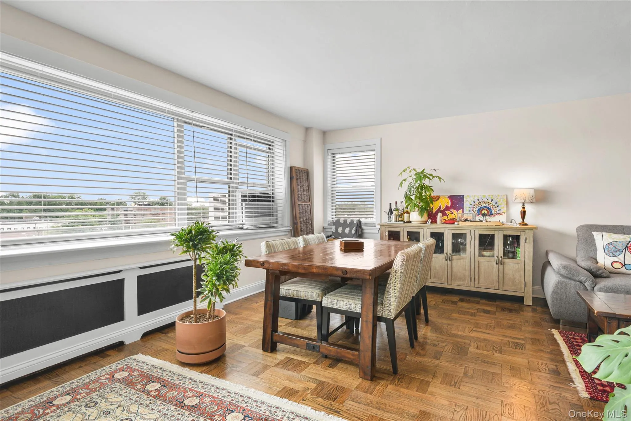 Parquet wood-finish flooring, expansive windows with high-end blinds Parquet wood-finish flooring, expansive windows with high-end blinds