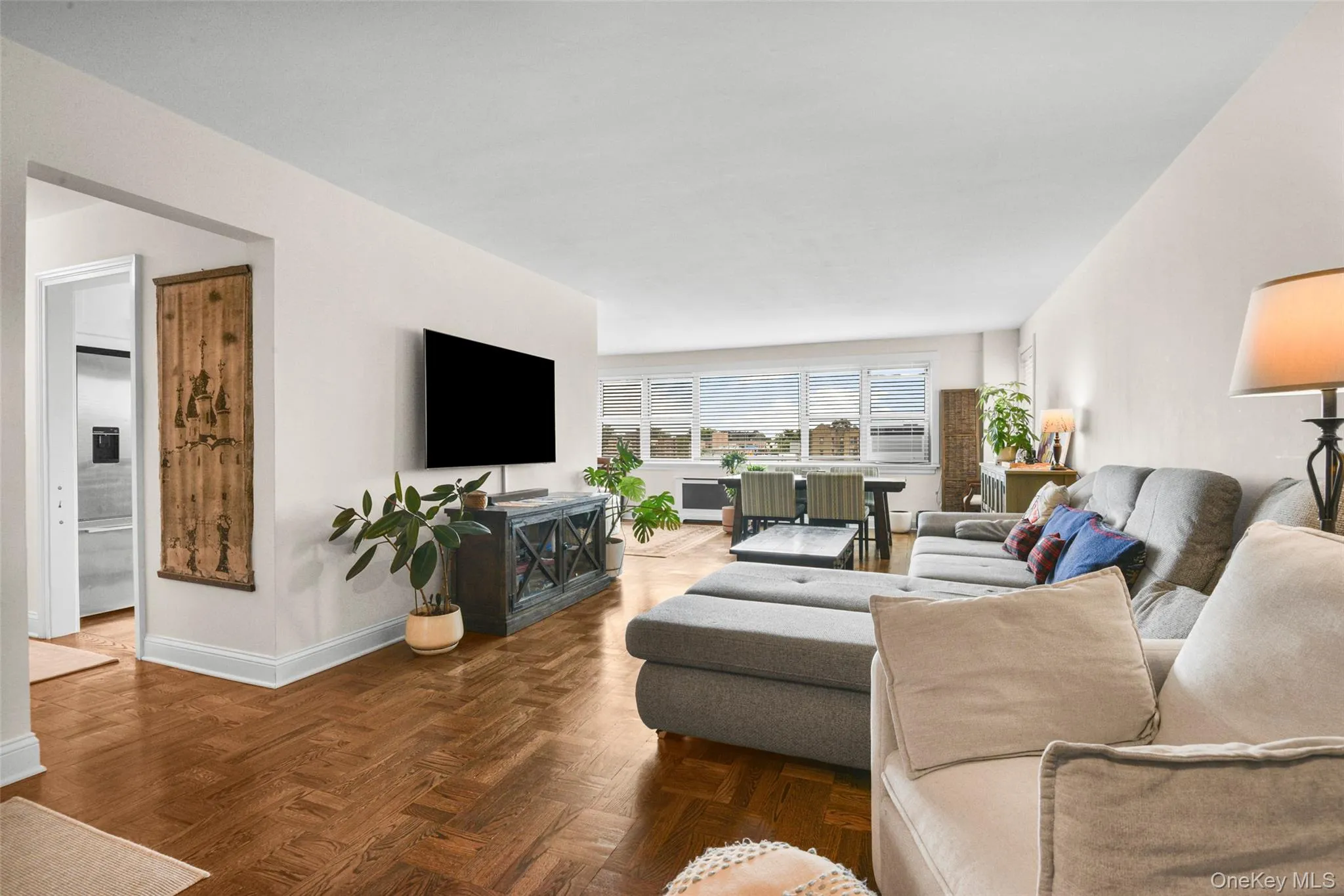 Hardwood parquet flooring and expansive windows Hardwood parquet flooring and expansive windows
