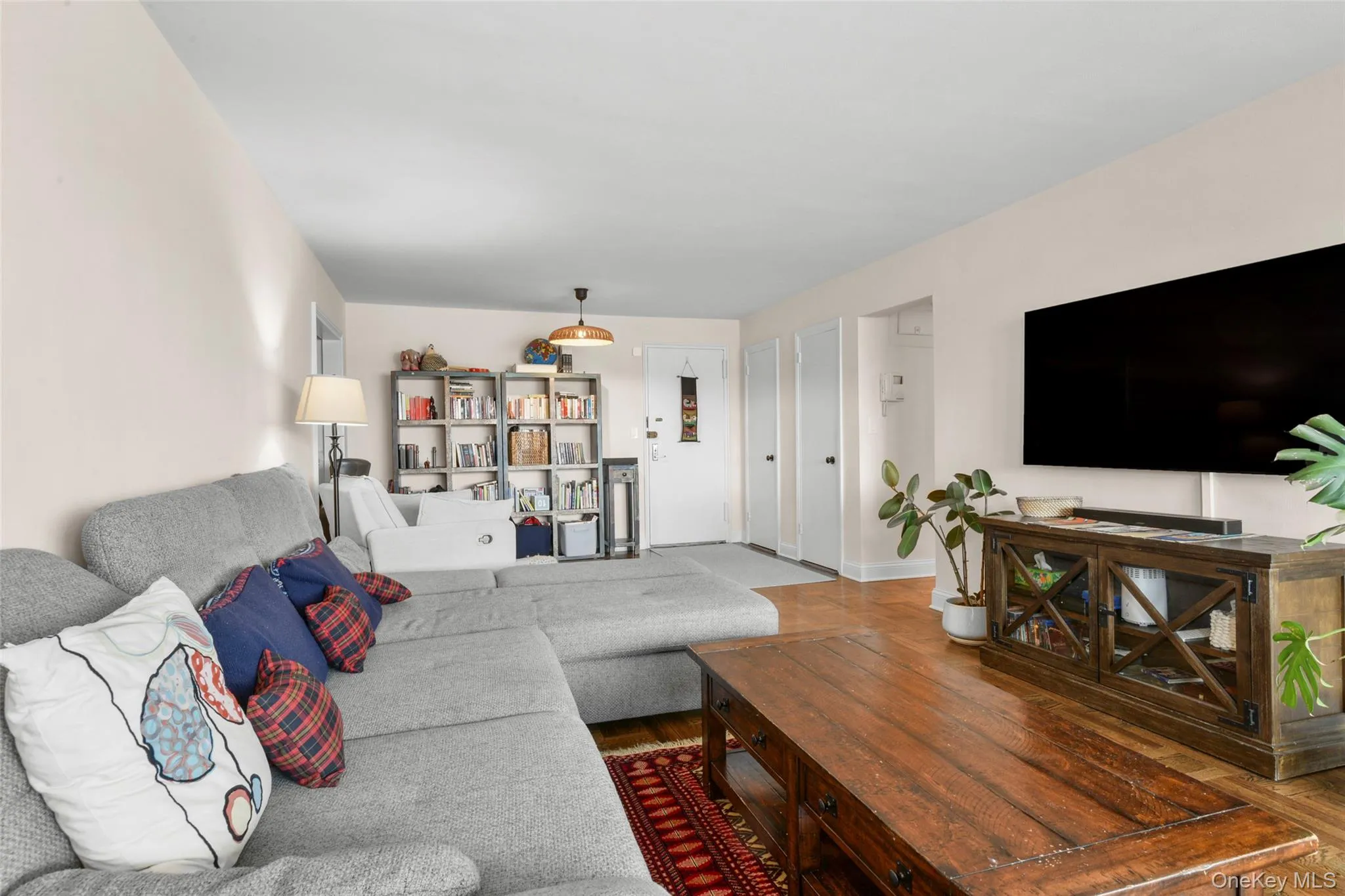 Warm wood-finish flooring complements the neutral wall tones Warm wood-finish flooring complements the neutral wall tones