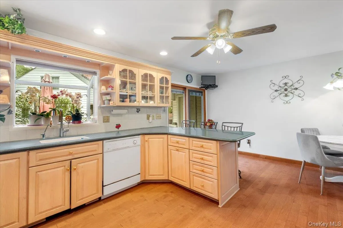 Well-appointed kitchen with breakfast bar and an abundance of cabinets and pantry storage. Well-appointed kitchen with breakfast bar and an abundance of cabinets and pantry storage.