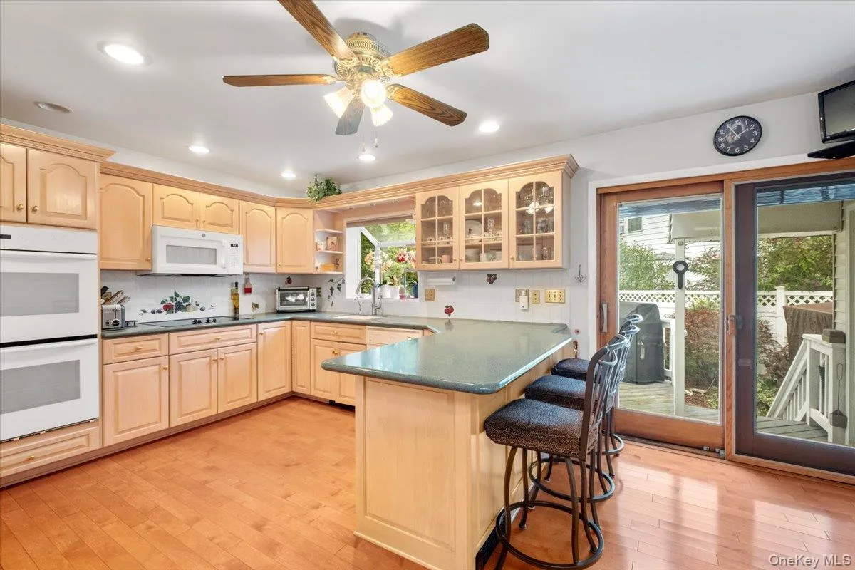 Well-appointed kitchen with breakfast bar and an abundance of cabinets and pantry storage. Well-appointed kitchen with breakfast bar and an abundance of cabinets and pantry storage.