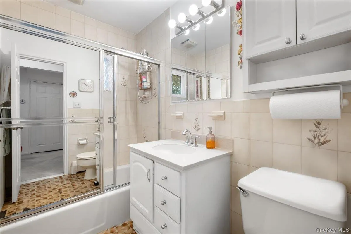 First floor bathroom, with tub and shower. First floor bathroom, with tub and shower.