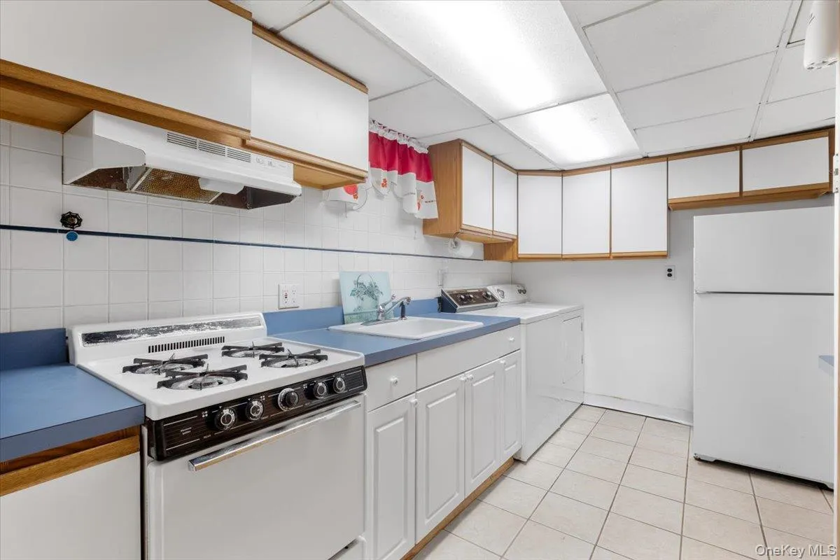 Lower level summer kitchen, with additional cabinet storage. Lower level summer kitchen, with additional cabinet storage.