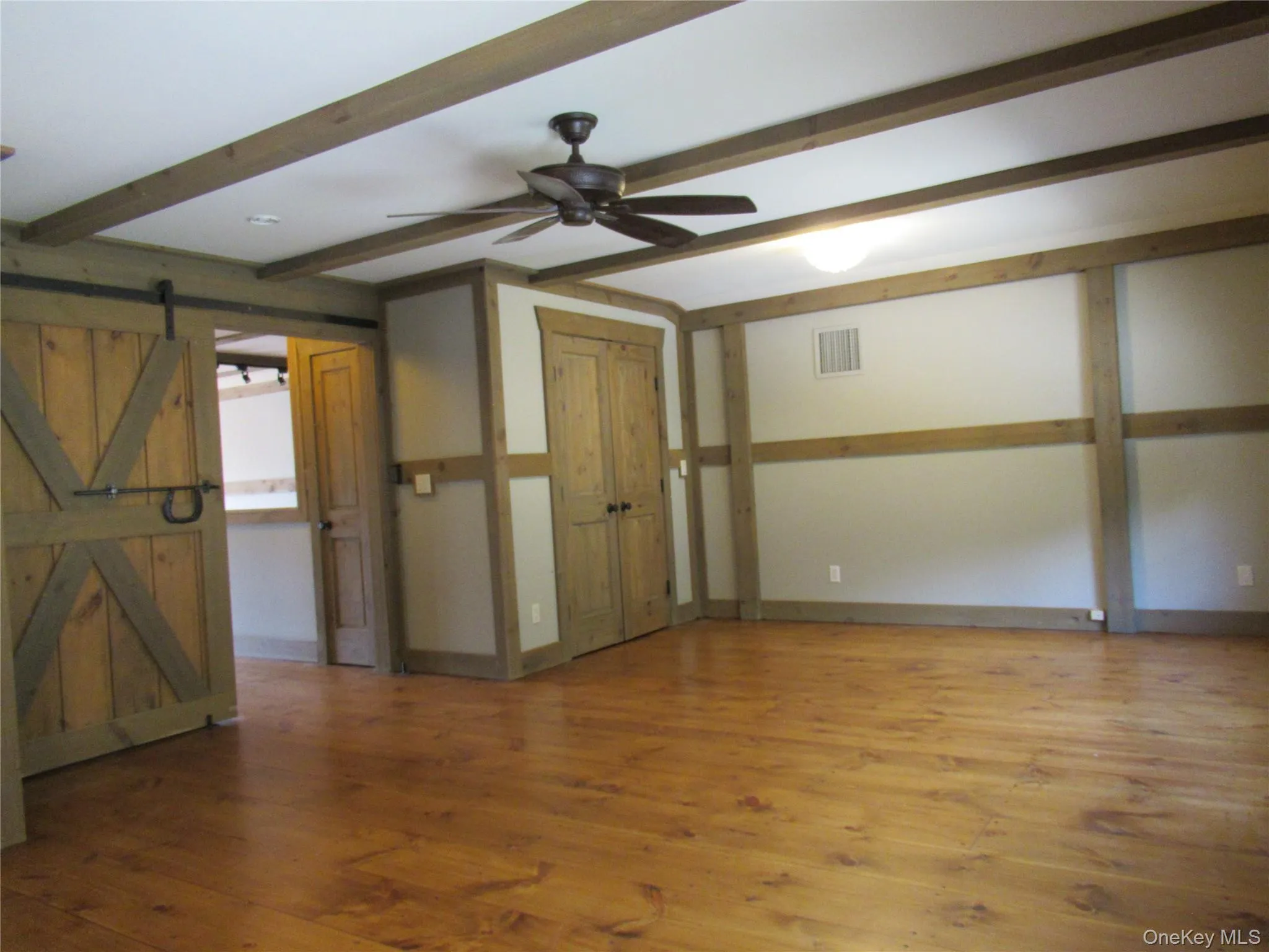 Another view with barn doors at entry Another view with barn doors at entry