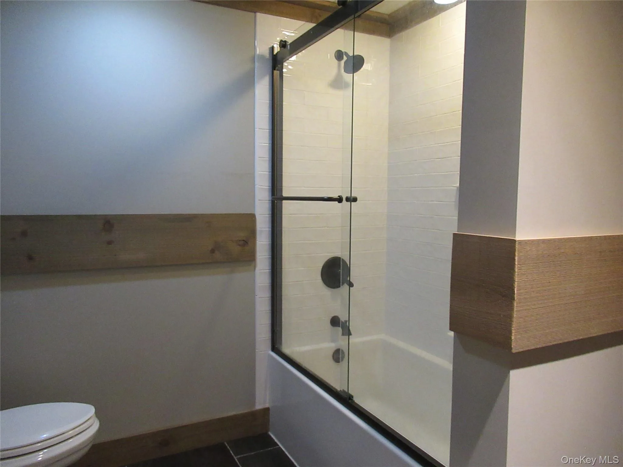 Newly renovated full bathtub and shower enclosure Newly renovated full bathtub and shower enclosure