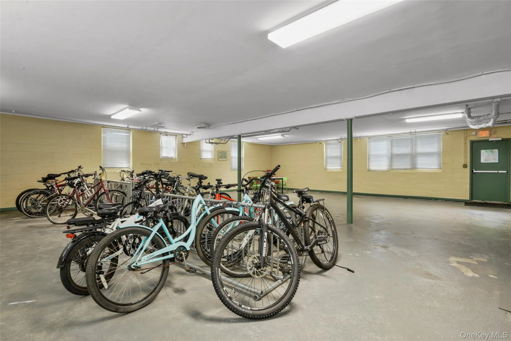 Bike room in basement with door out Bike room in basement with door out