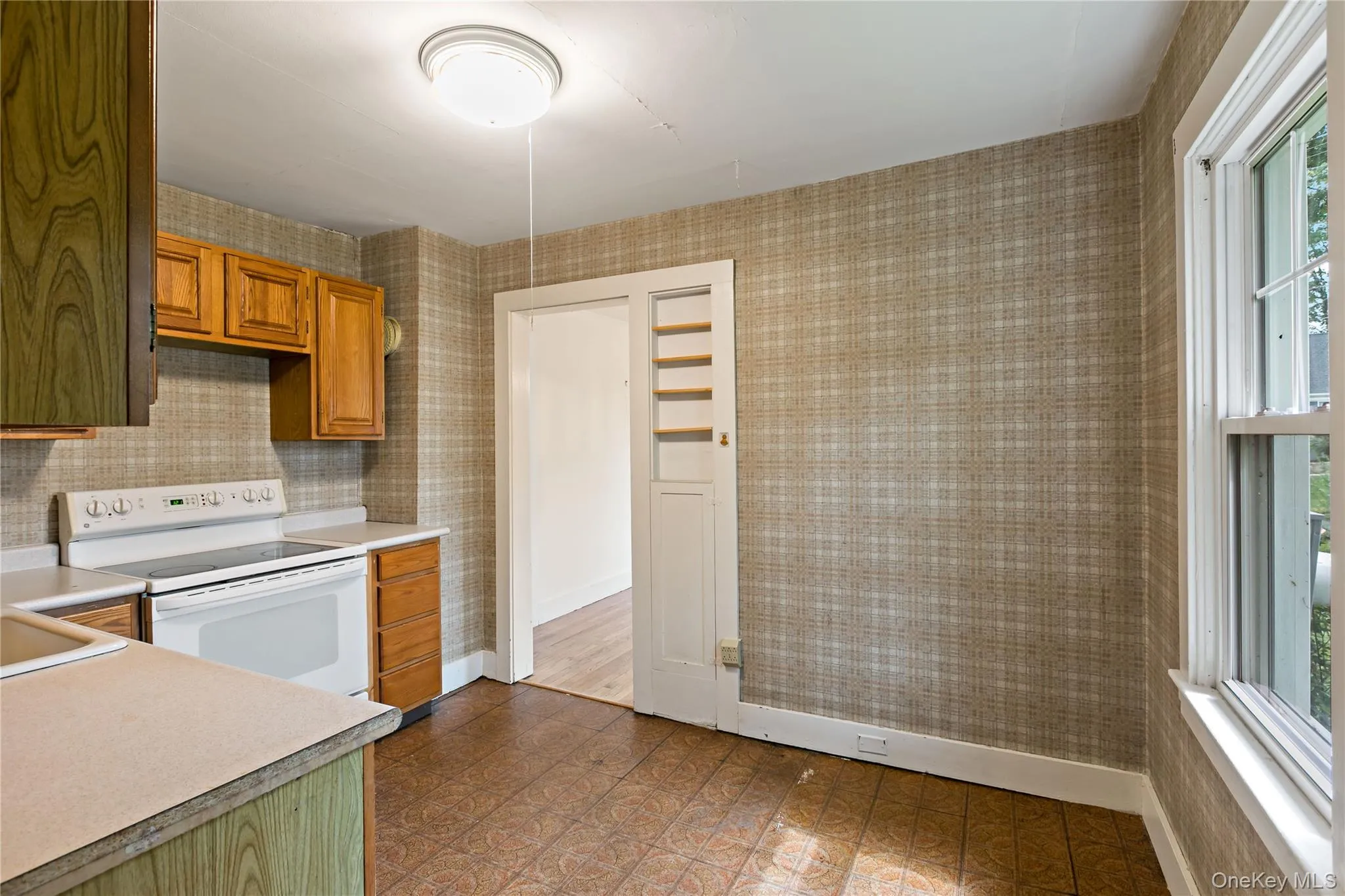 Another angle of kitchen with door to dining room. Another angle of kitchen with door to dining room.