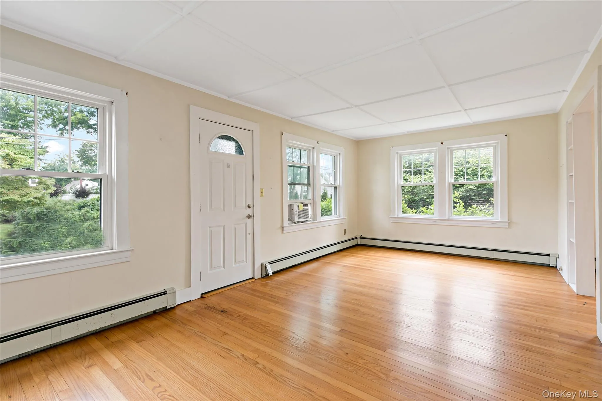 Another angle of front door and spacious living room. Another angle of front door and spacious living room.